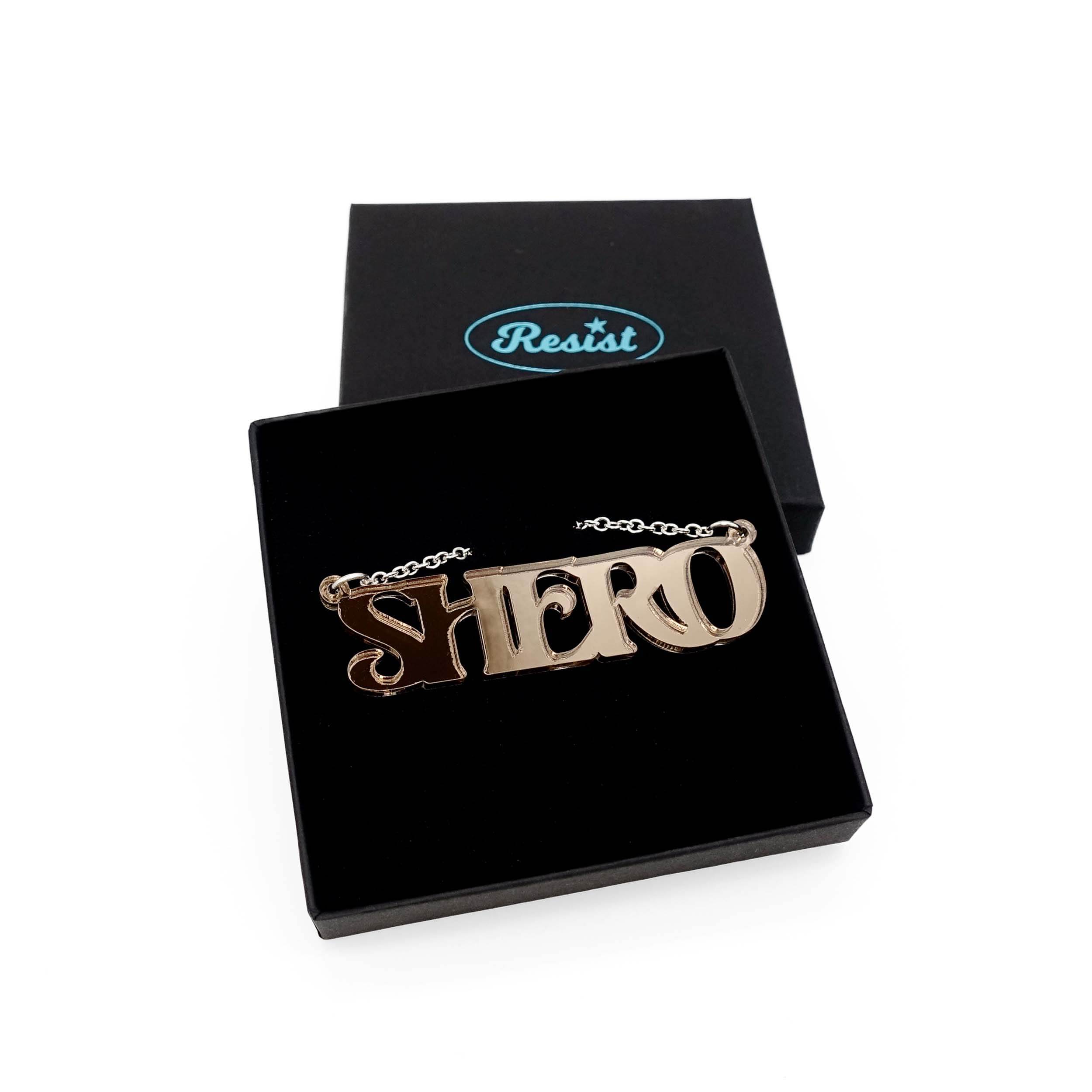 Bronze mirror Shero necklace shown in a Wear and Resist gift box.