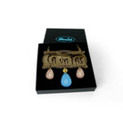 Belle Epoque inspired CA VA PAS necklace with rose gold and sky drops. A glamourous way to express your dissatisfaction with the status quo! Shown in a Wear and Resist gift box.