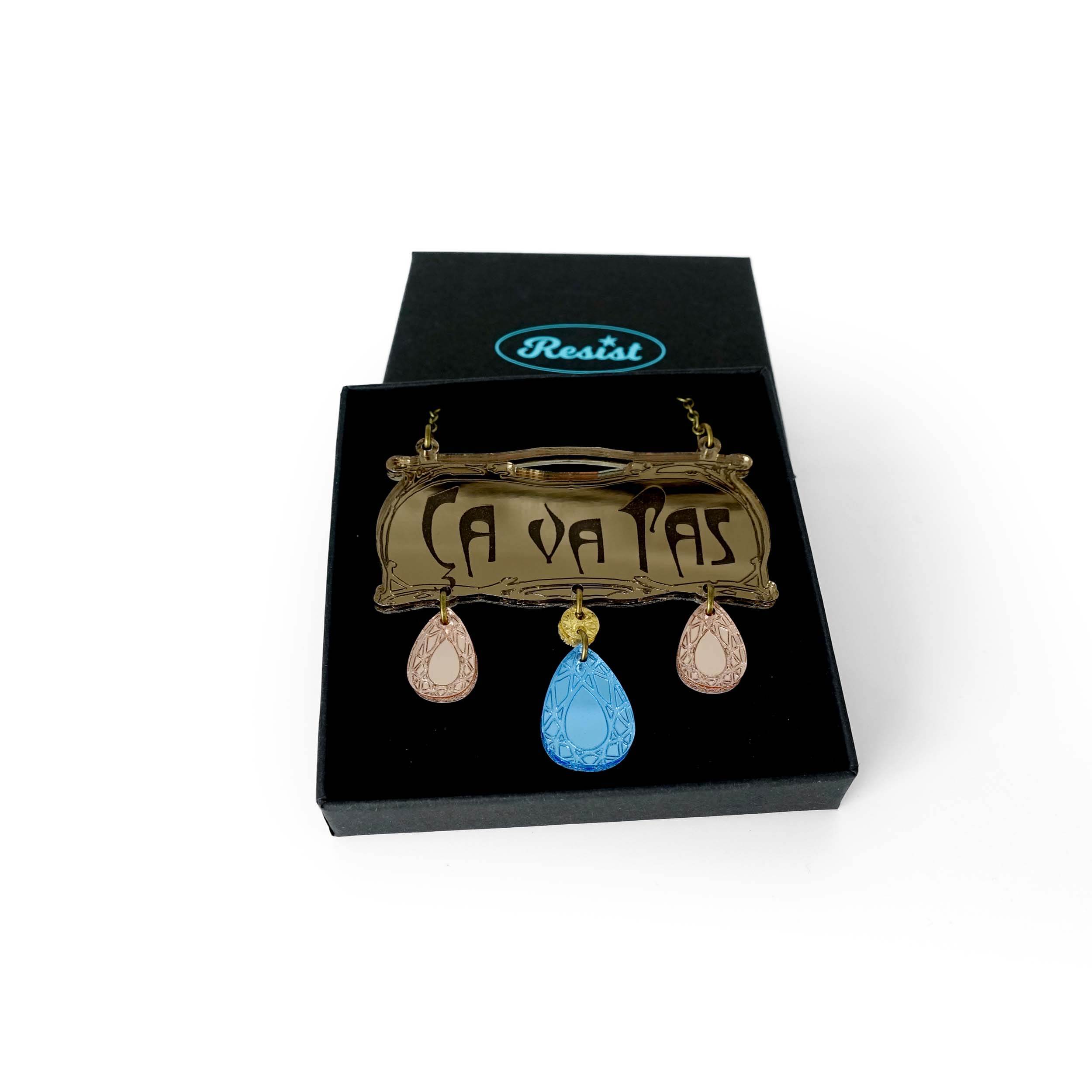 Belle Epoque inspired CA VA PAS necklace with rose gold and sky drops. A glamourous way to express your dissatisfaction with the status quo! Shown in a Wear and Resist gift box.