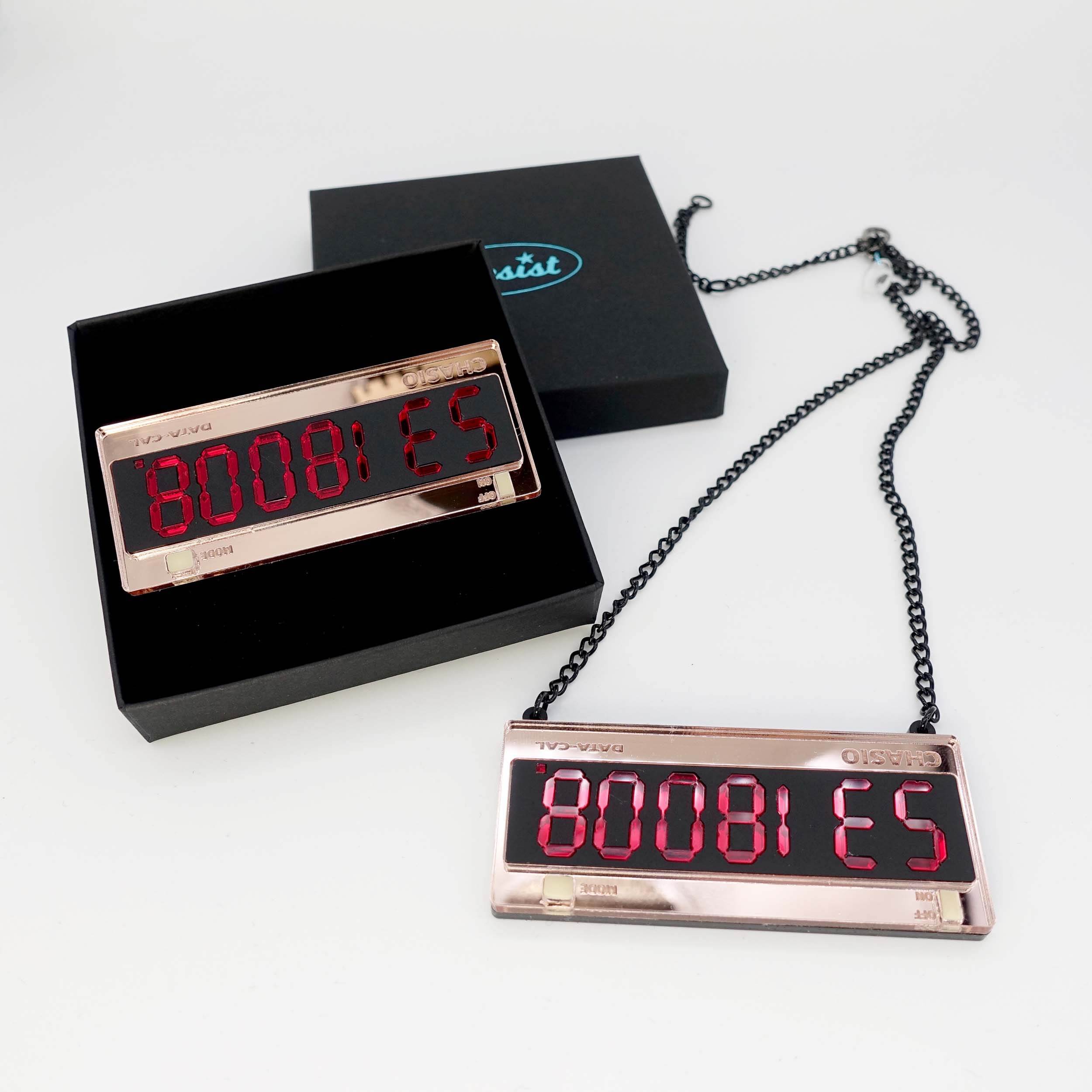 Calculator BOOBIES brooch and necklace shown together.