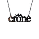 Crone necklace in black glitter , shown hanging against a white background.