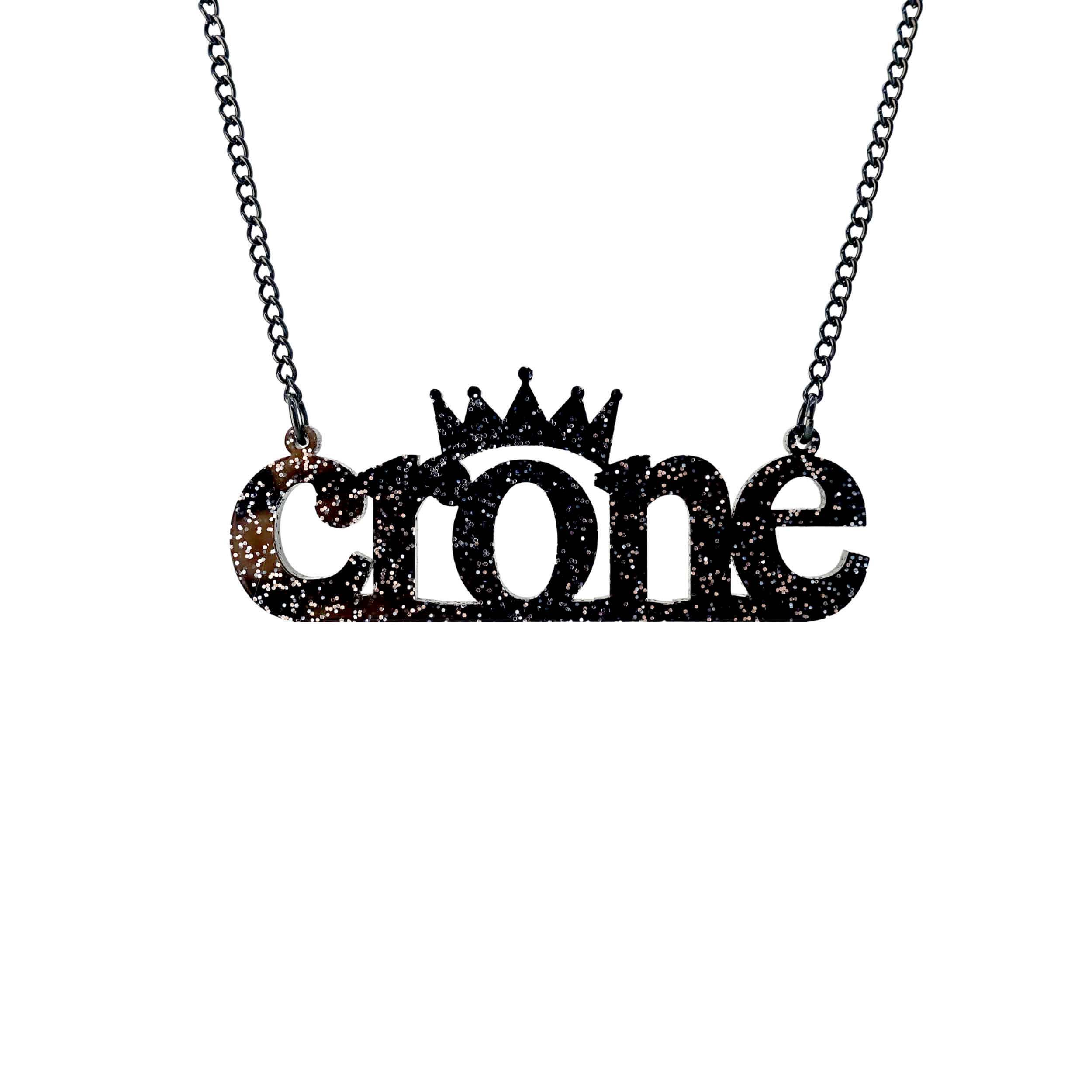 Crone necklace in black glitter , shown hanging against a white background.