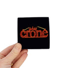 Crone necklace in flame glitter, shown in a Wear and Resist gift box.