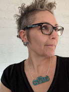 Crone necklace in glitter teal, as modelled by the Persisterhood!