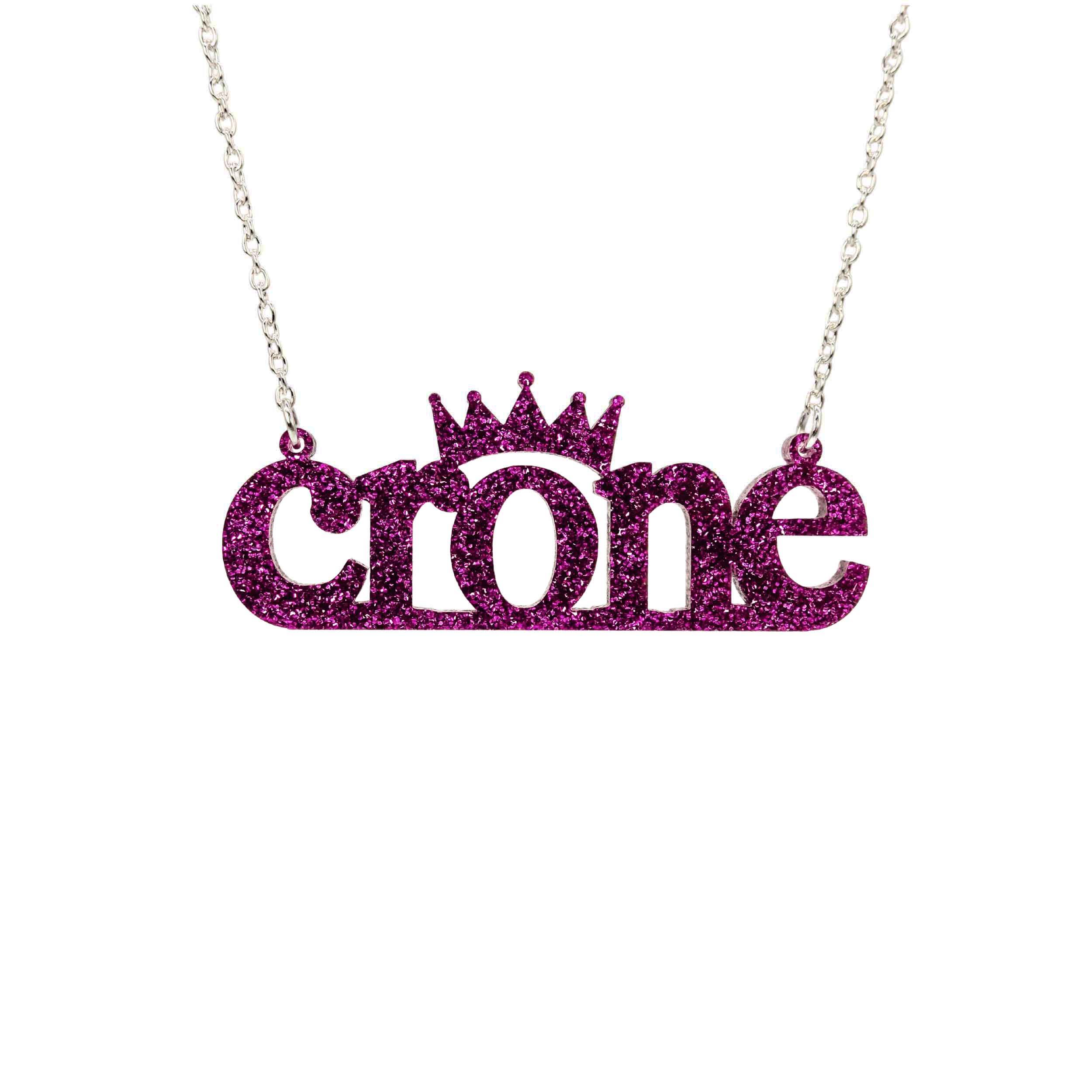 Crone necklace in purple glitter, shown hanging against a white background.