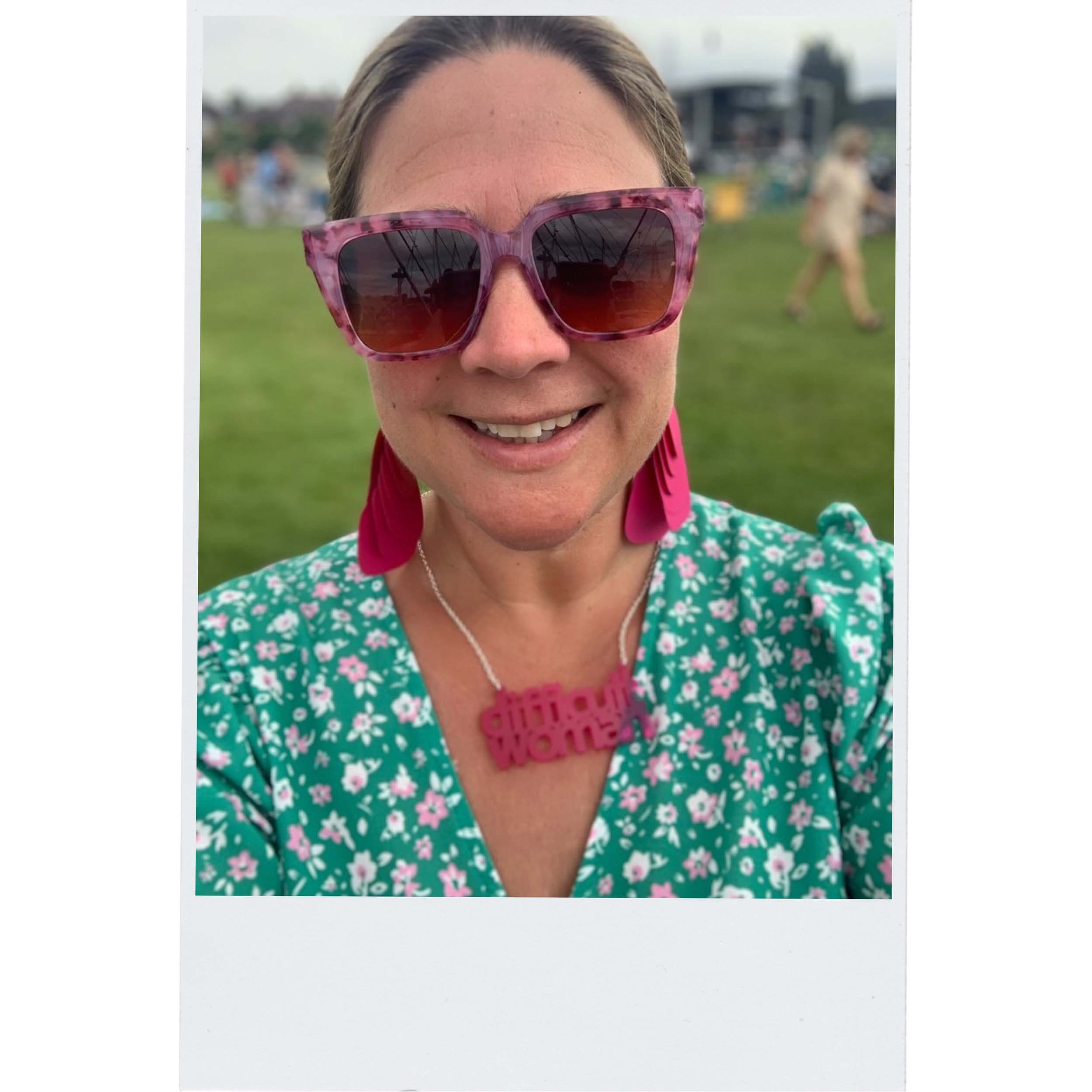 Amy wears a Difficult Woman necklace in neon pink. Designed by Sarah Day for Wear and Resist.