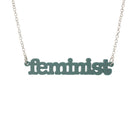 Duck egg green Feminist necklace shown hanging on a white background.