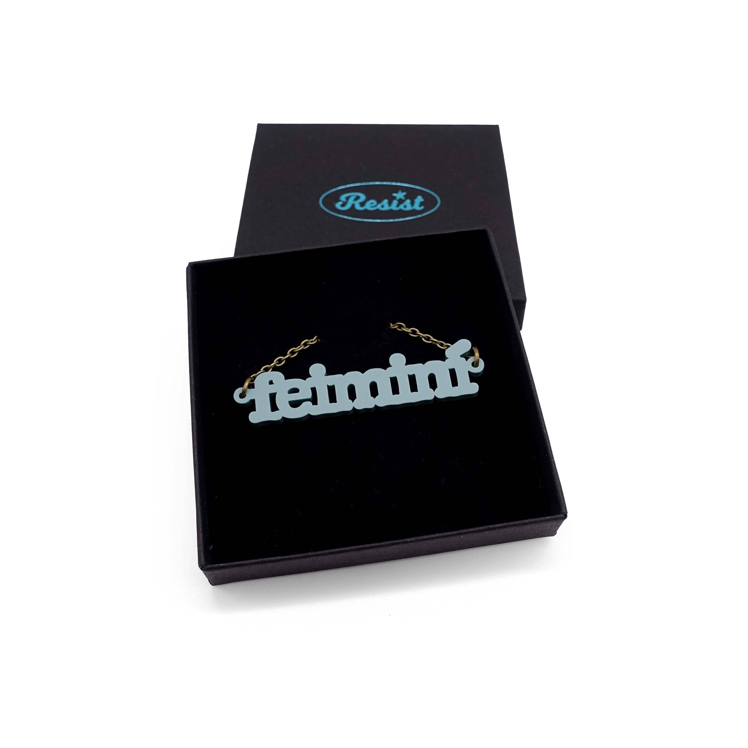Irish Gaelic Feiminí necklace in duck egg green, shown in a Wear and Resist gift box.