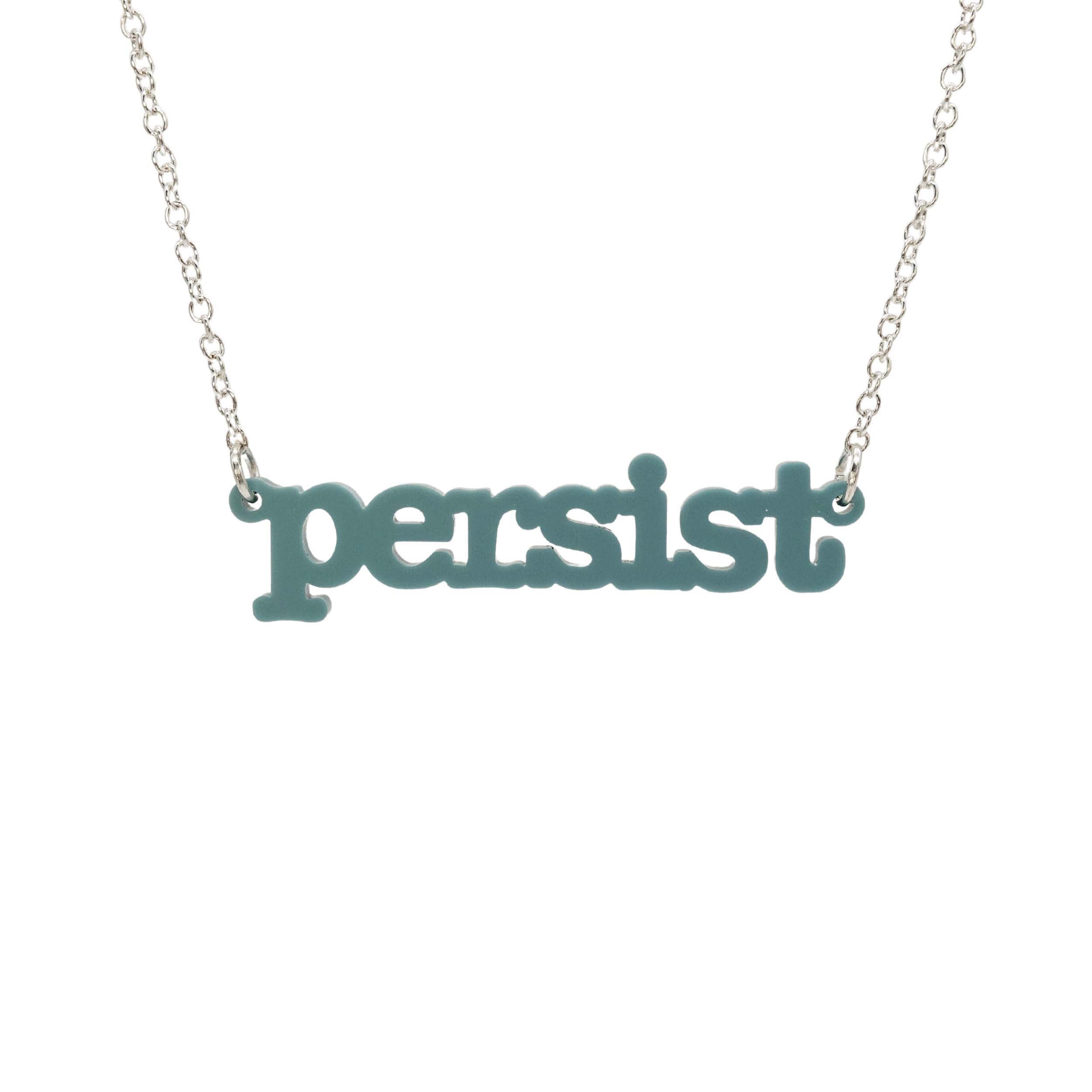 Duck egg green Persist necklace in typewriter font hanging on a silver chain against a white background.