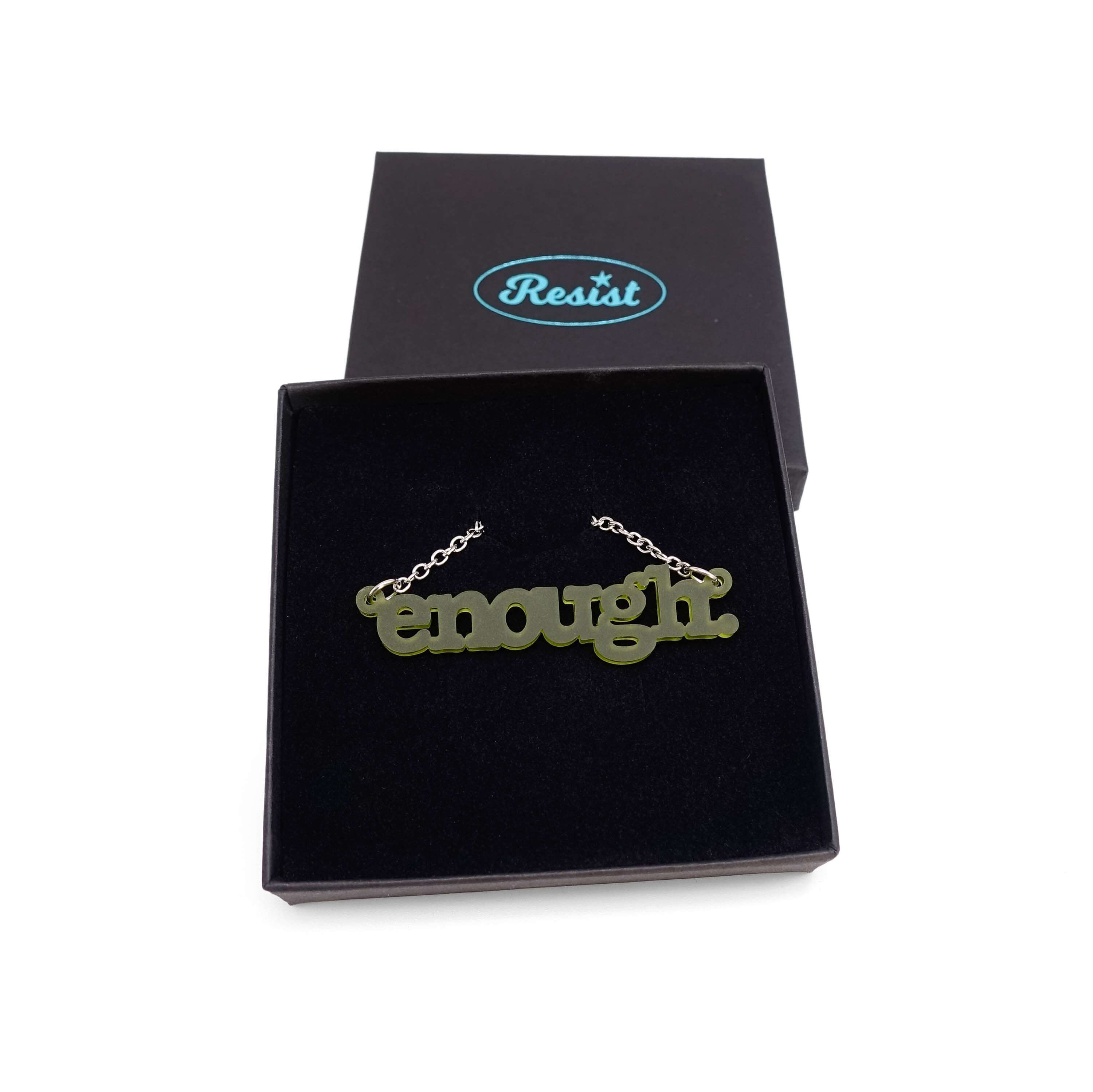 Typewriter Enough necklace in olive frost shown in a Wear and Resist gift box.