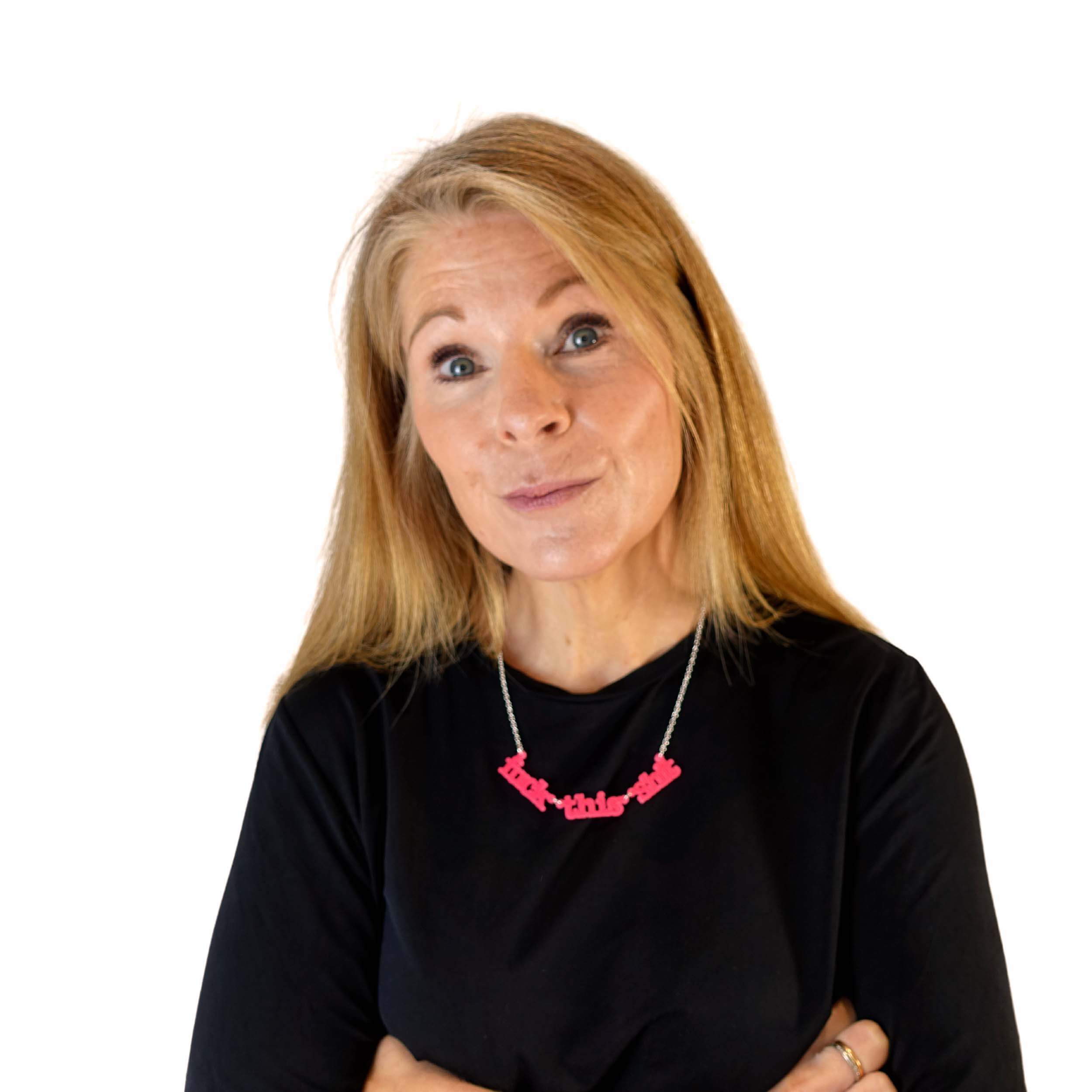 Sarah wears a F*ck this Sh*t necklace in hot pink.