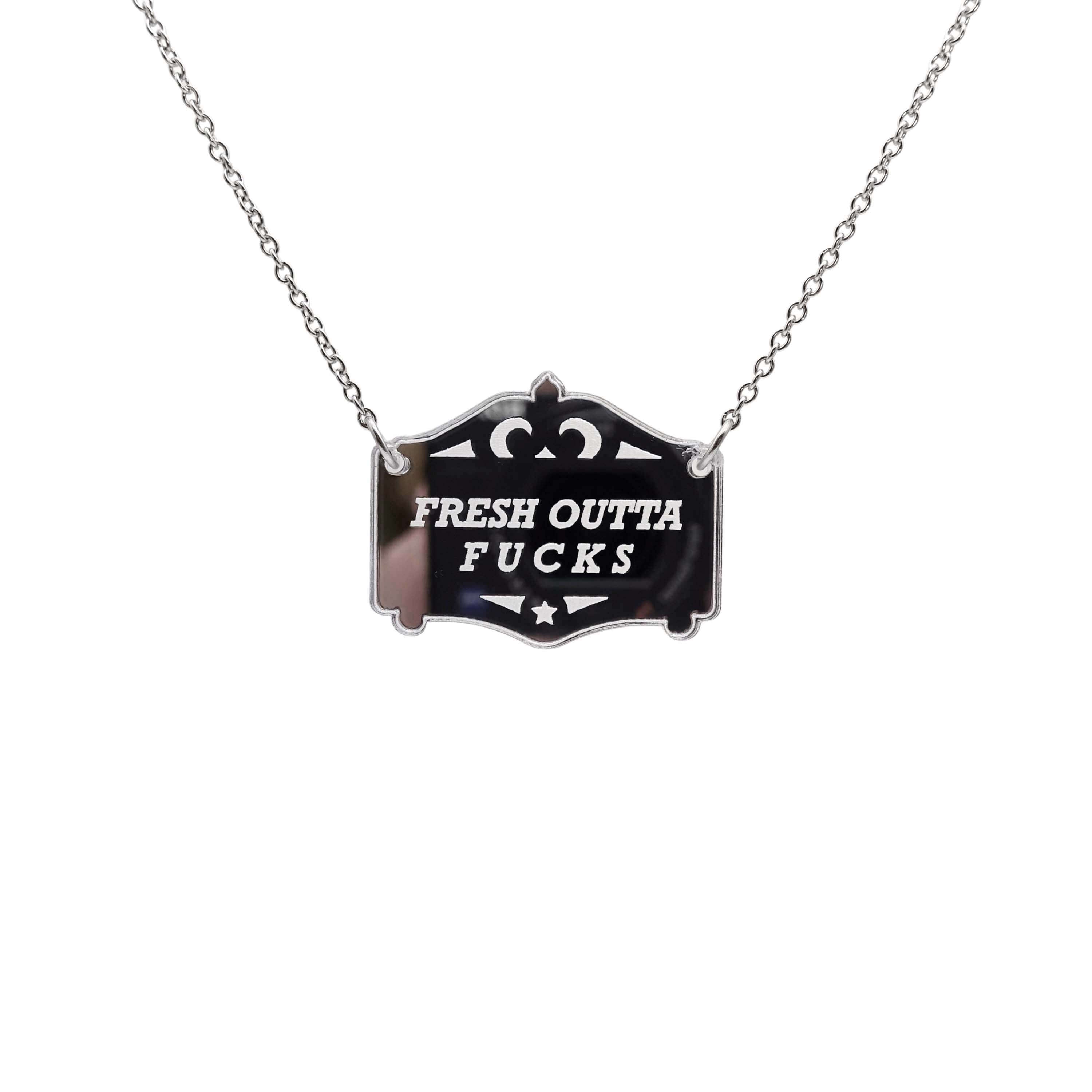 Fresh outta f*cks mirror cowboy necklace in silver shown hanging on a stainless steel chain.
