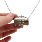 F*ck this sh*t mirror cowboy necklace in silver, shown hanging on a stainless steel chain with my hand for scale.