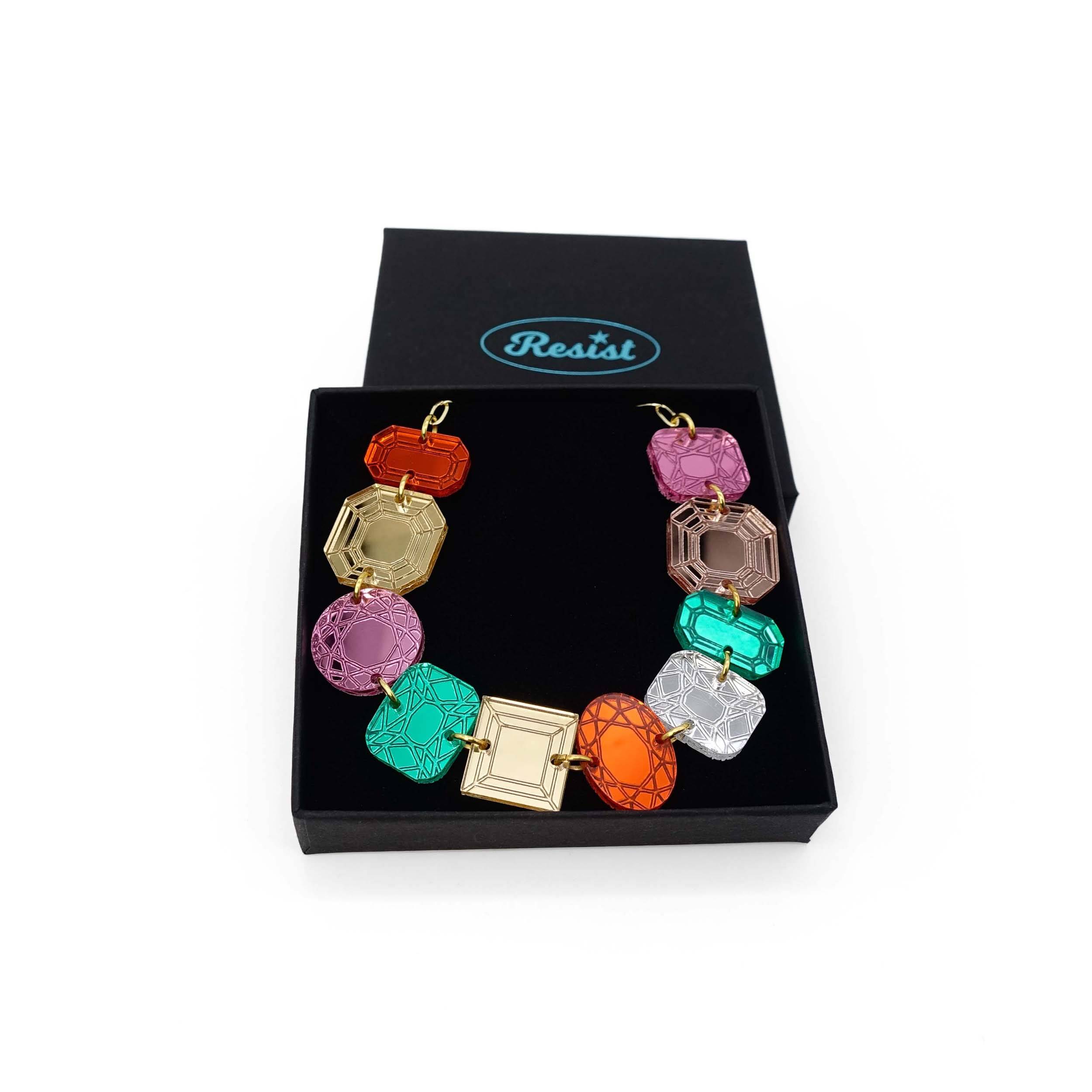Funky Jewel mismatched gem necklace, designed by Sarah Day as part of the Austerity Jewels collection, shown in a Wear and Resist gift box. £2 goes to Women for Refugee Women charity.