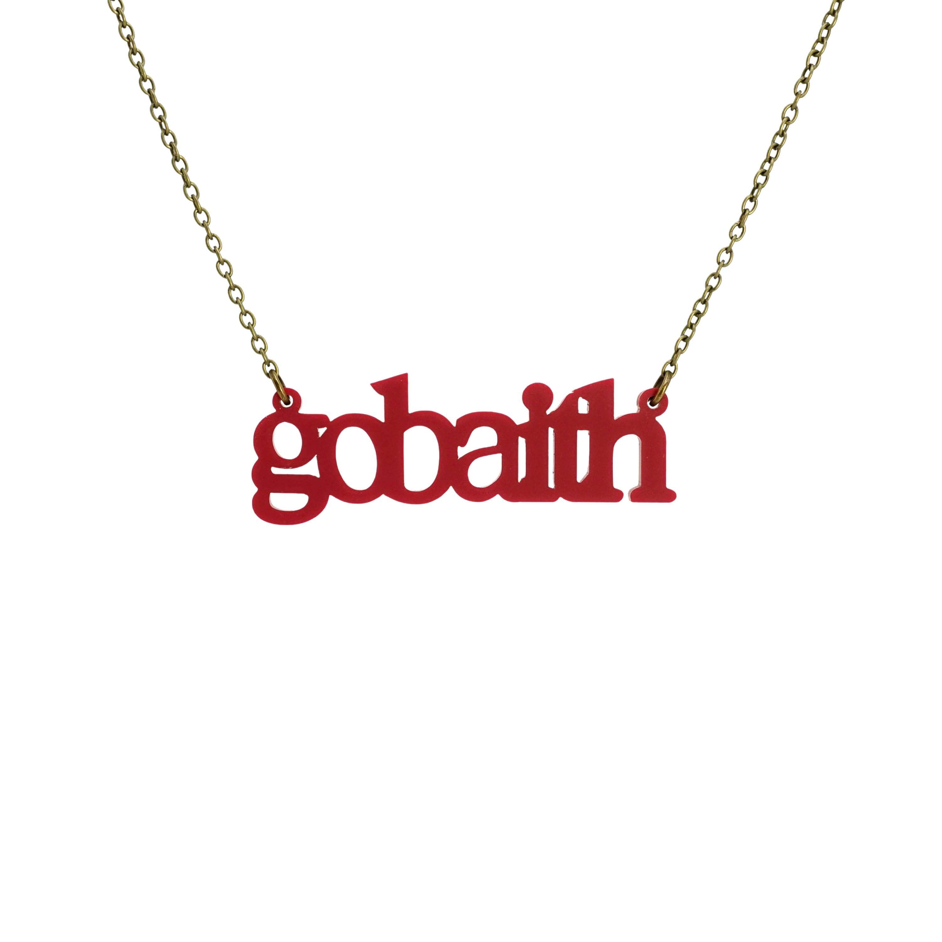 Gobaith Welsh hope necklace in oxblood shown hanging on an antique gold chain.