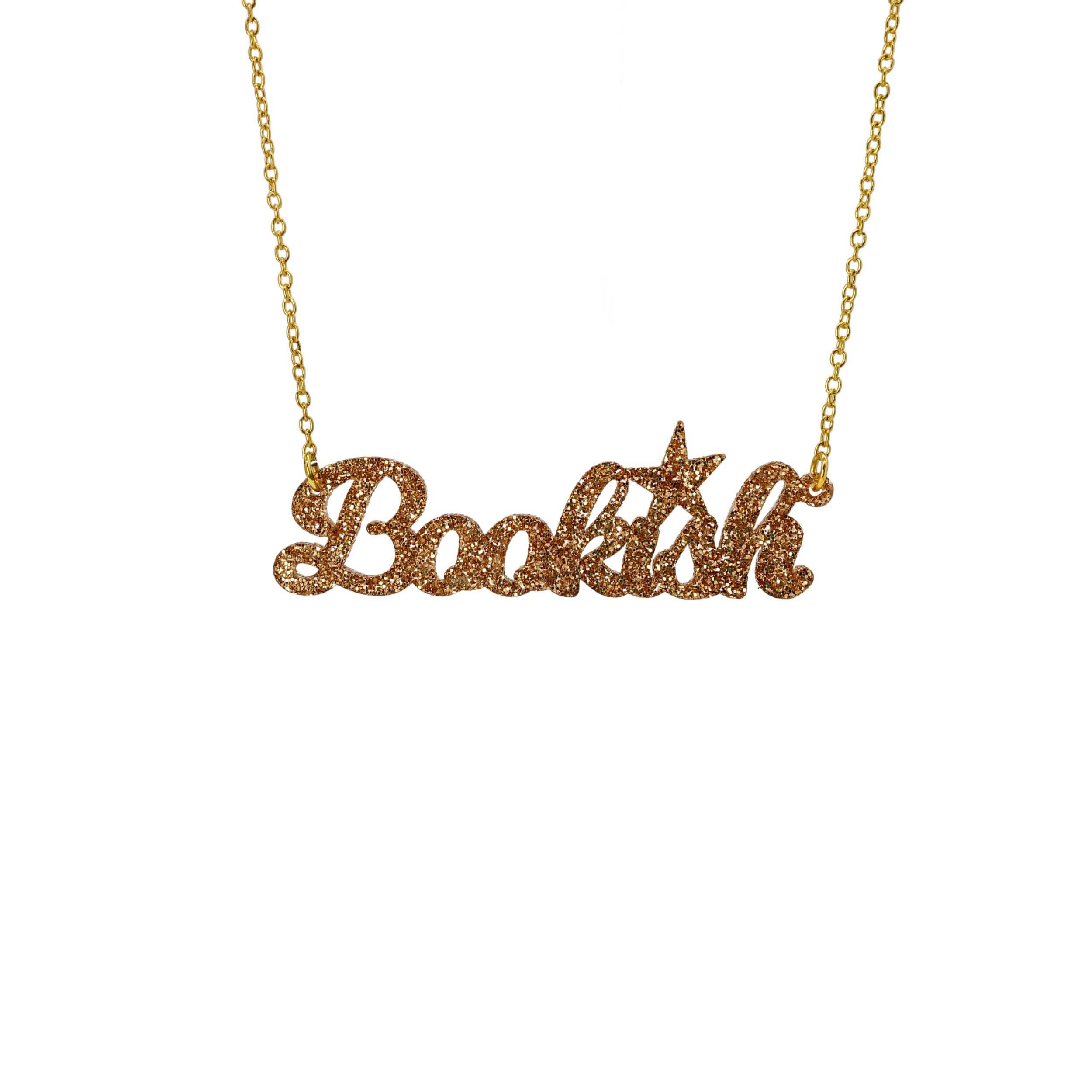 Bookish necklace in gold glitter, shown against a white background.
