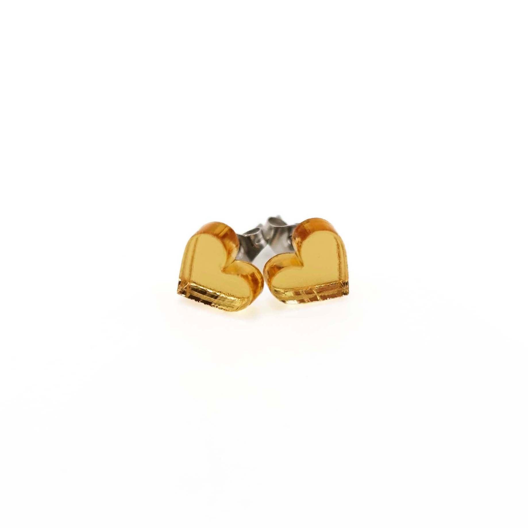 Small heart earrings in gold mirror, shown against a white background.