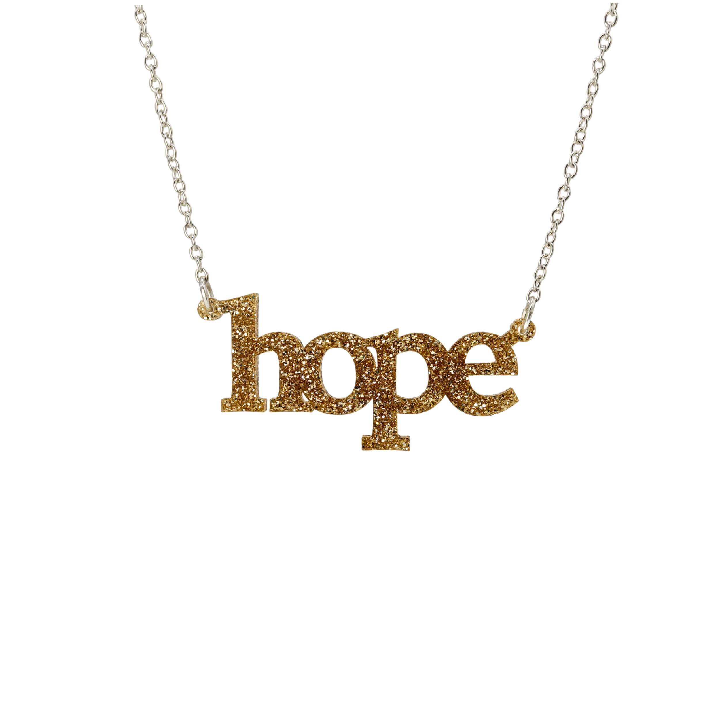 Hope necklace in gold glitter shown on a silver chain hanging on a white background.