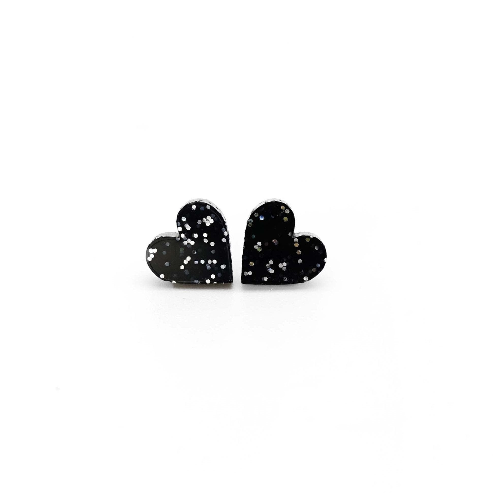 Little heart earrings in black glitter. Simple and effective black sparkly heart studs to wear every day to remind yourself of your own love.