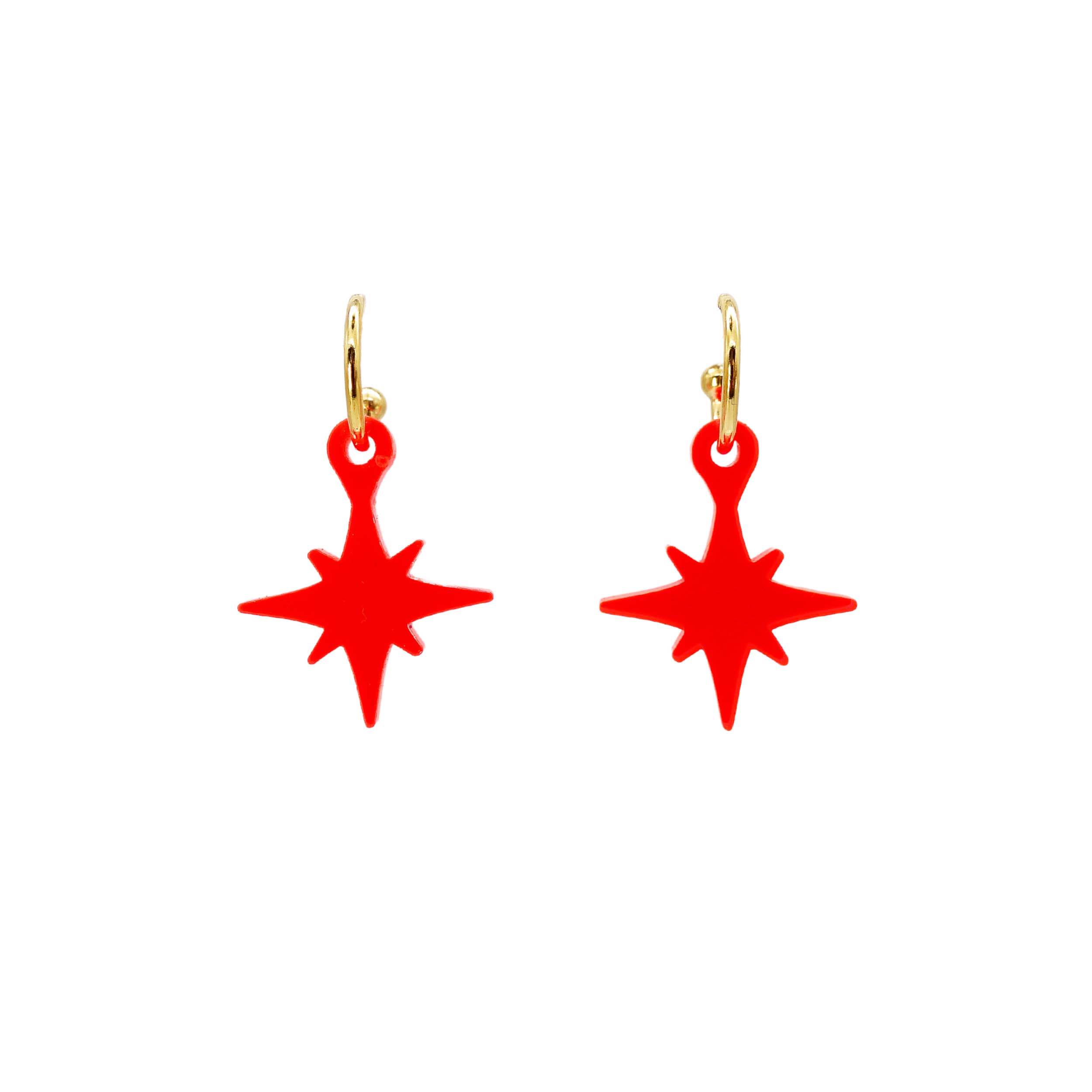 Neon red vintage star earrings on gold hoops shown hanging on a white background.