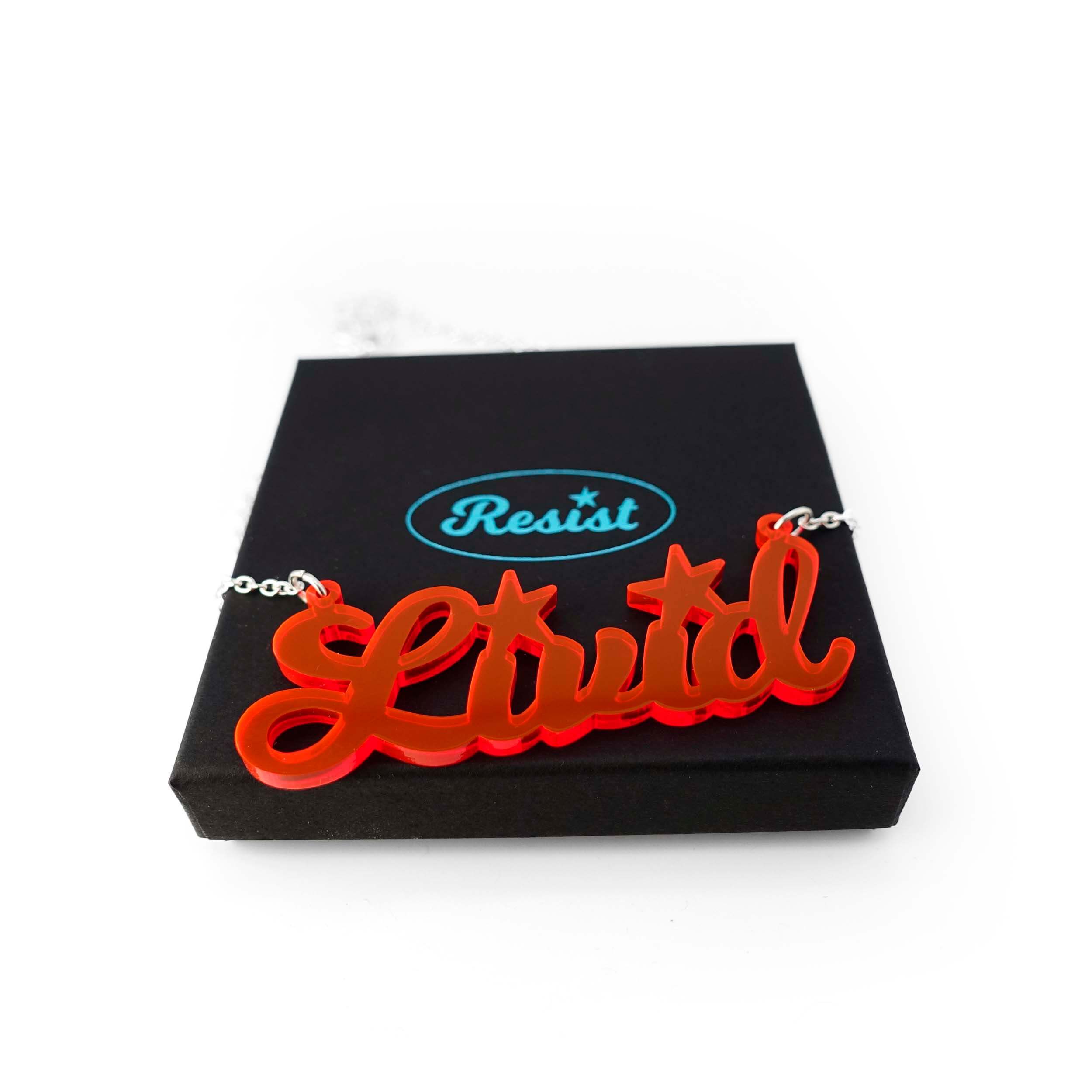 Livid necklace in hot red shown on a Wear and Resist gift box.