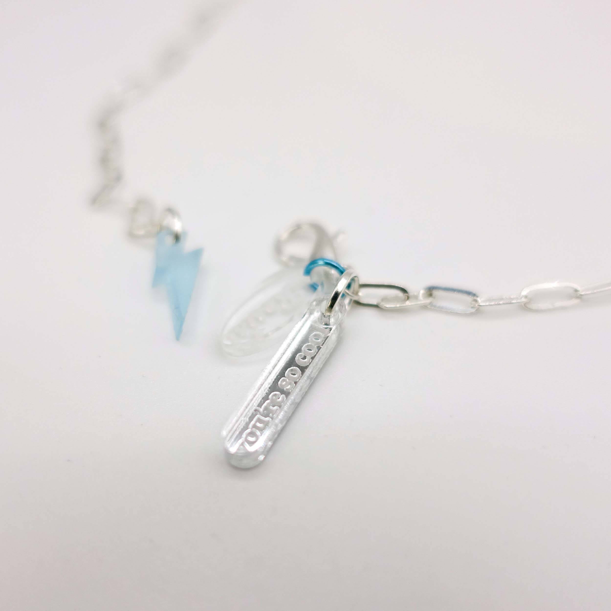 Little You're so cool tag on the I love me glow in the dark choker and bracelet on a choice of silver or gold plated delicate paperclip chain.
