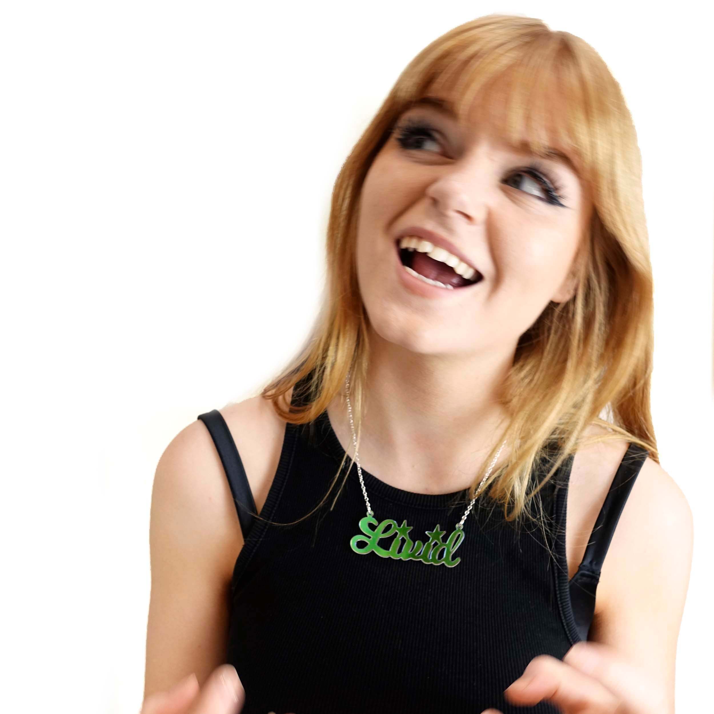 Eliza wears an iridescent Livid necklace.