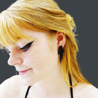 Eliza wars large Lightning Bolt earrings in matte black.