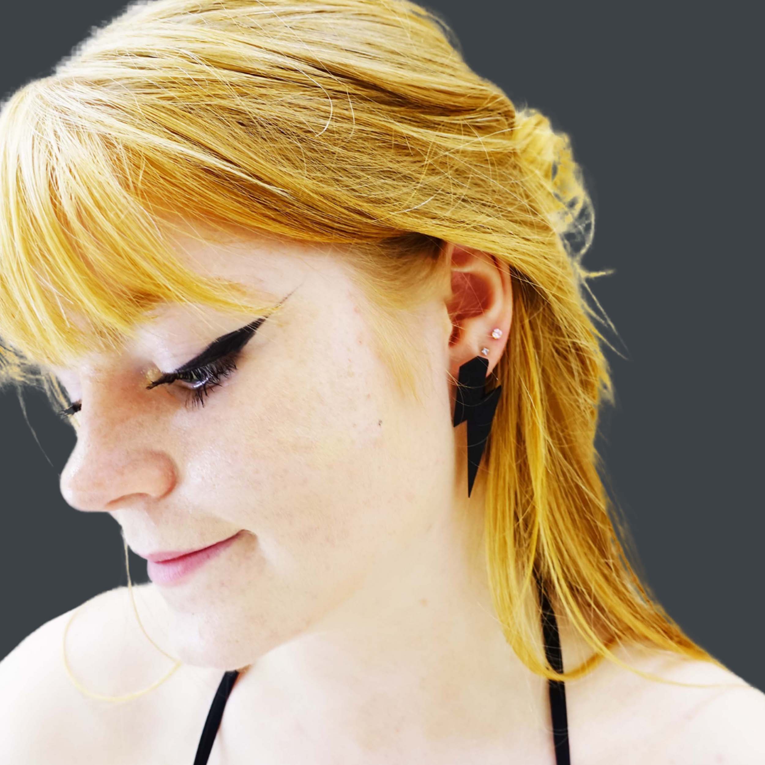 Eliza wars large Lightning Bolt earrings in matte black.