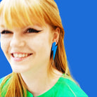 Eliza wears large Lightning Bolt earrings in Matisse Blue.
