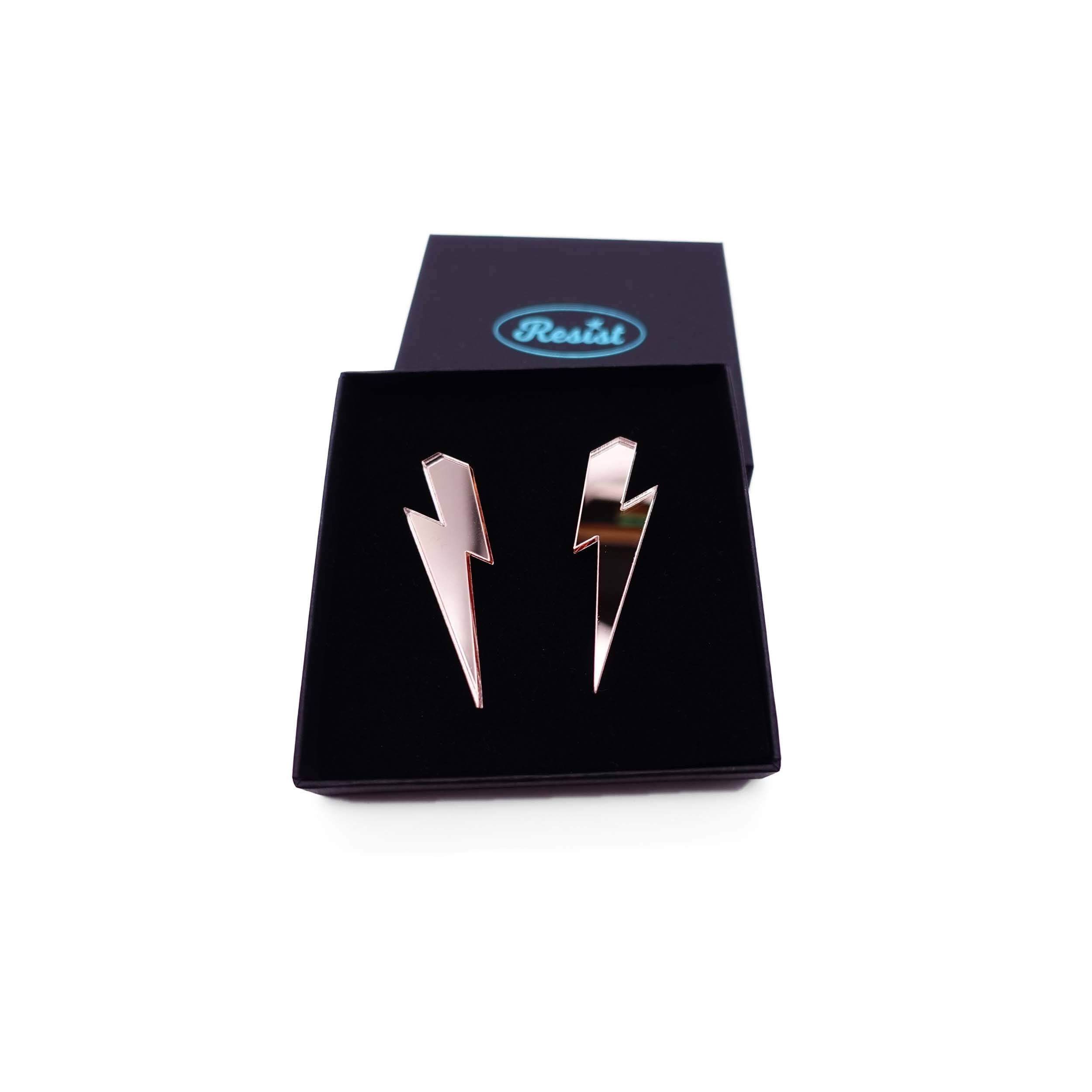Large Lightning Bolt earrings in rose gold mirror, shown in a Wear and Resist gift box.