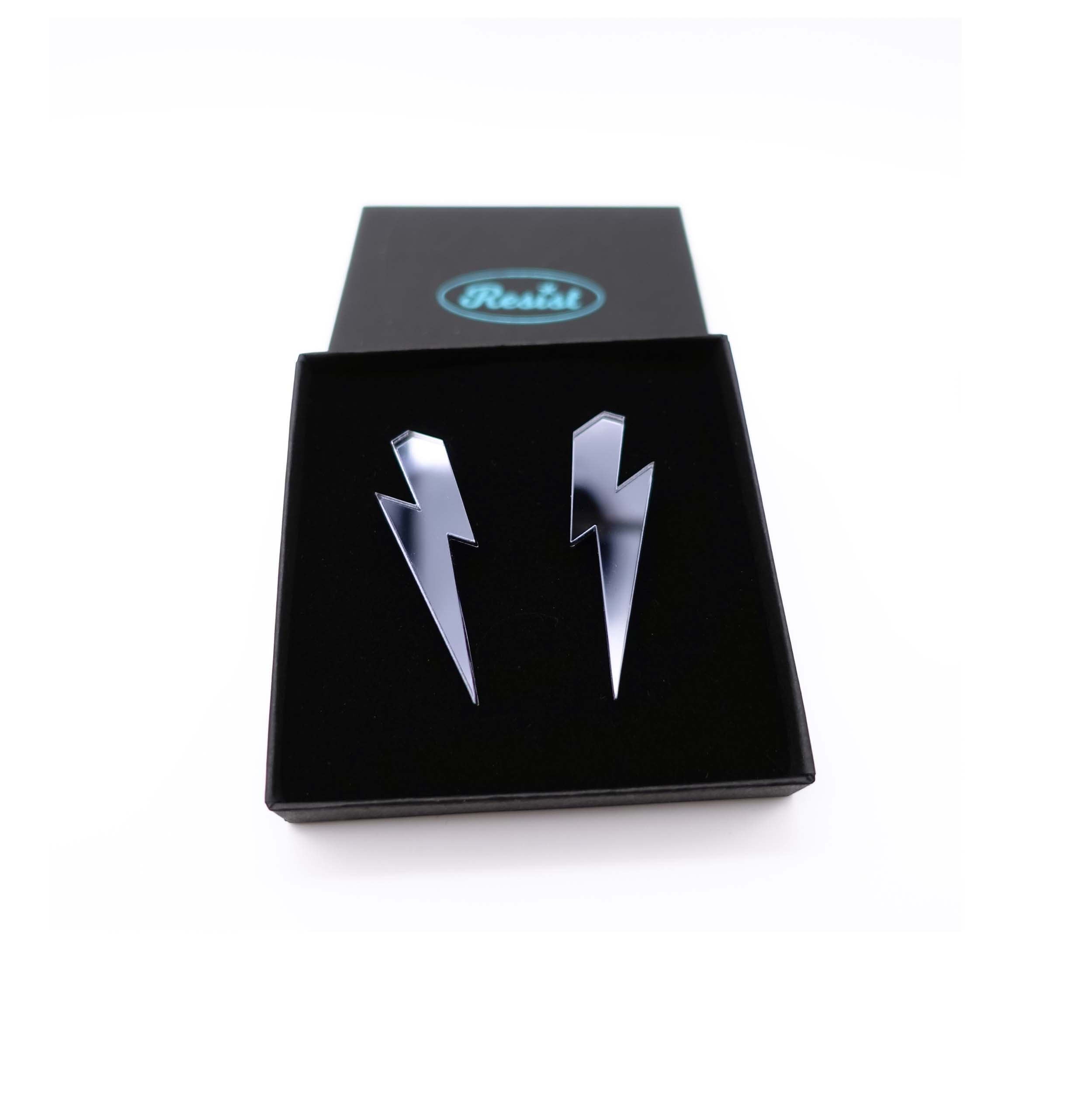 Medium Lightning Bolt earrings in slate mirror, shown in a Wear and Resist gift box.