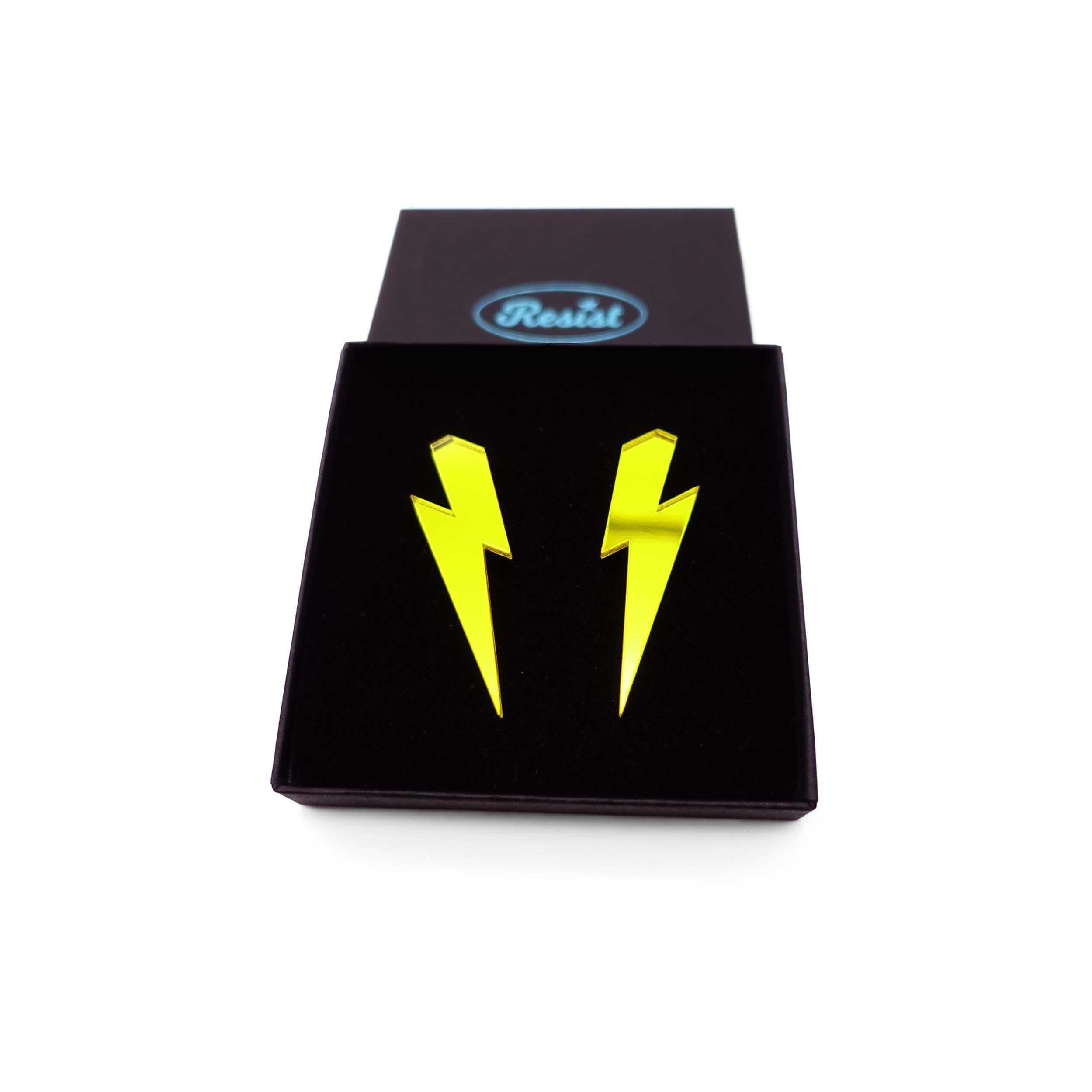 Large Lightning Bolt earrings in yellow mirror, shown in a Wear and Resist gift box.