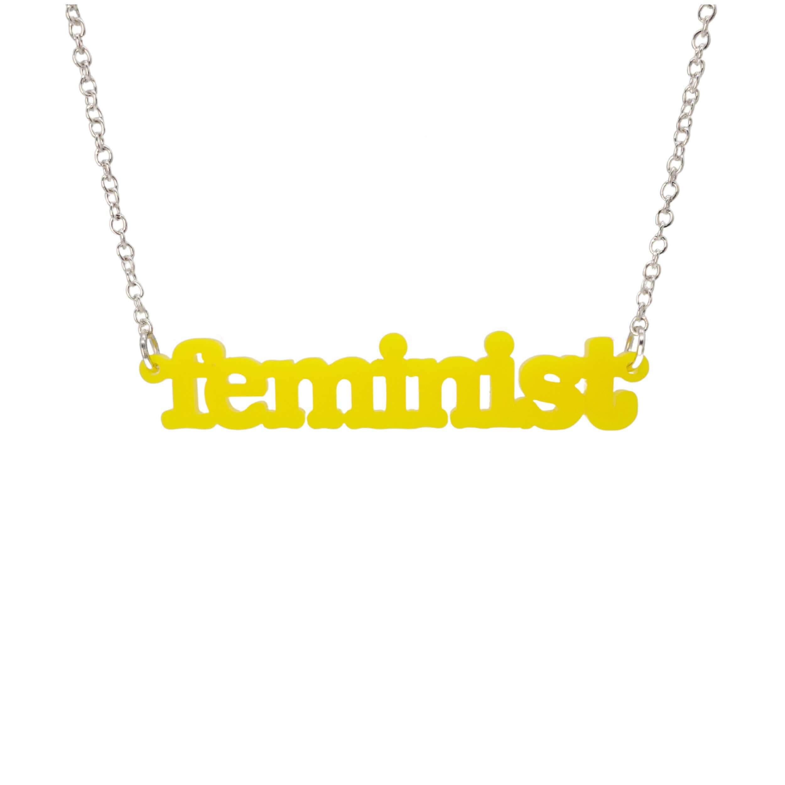 Matte lemon Feminist necklace shown hanging on a white background.