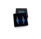 Lightning bolt hoop earrings in blue glitter on silver-plated hoops, shown in a Wear and Resist gift box.