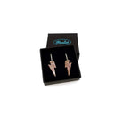 Lightning bolt hoop earrings in pink fizz glitter on silver-plated hoops, shown in a smallWear and Resist gift box.