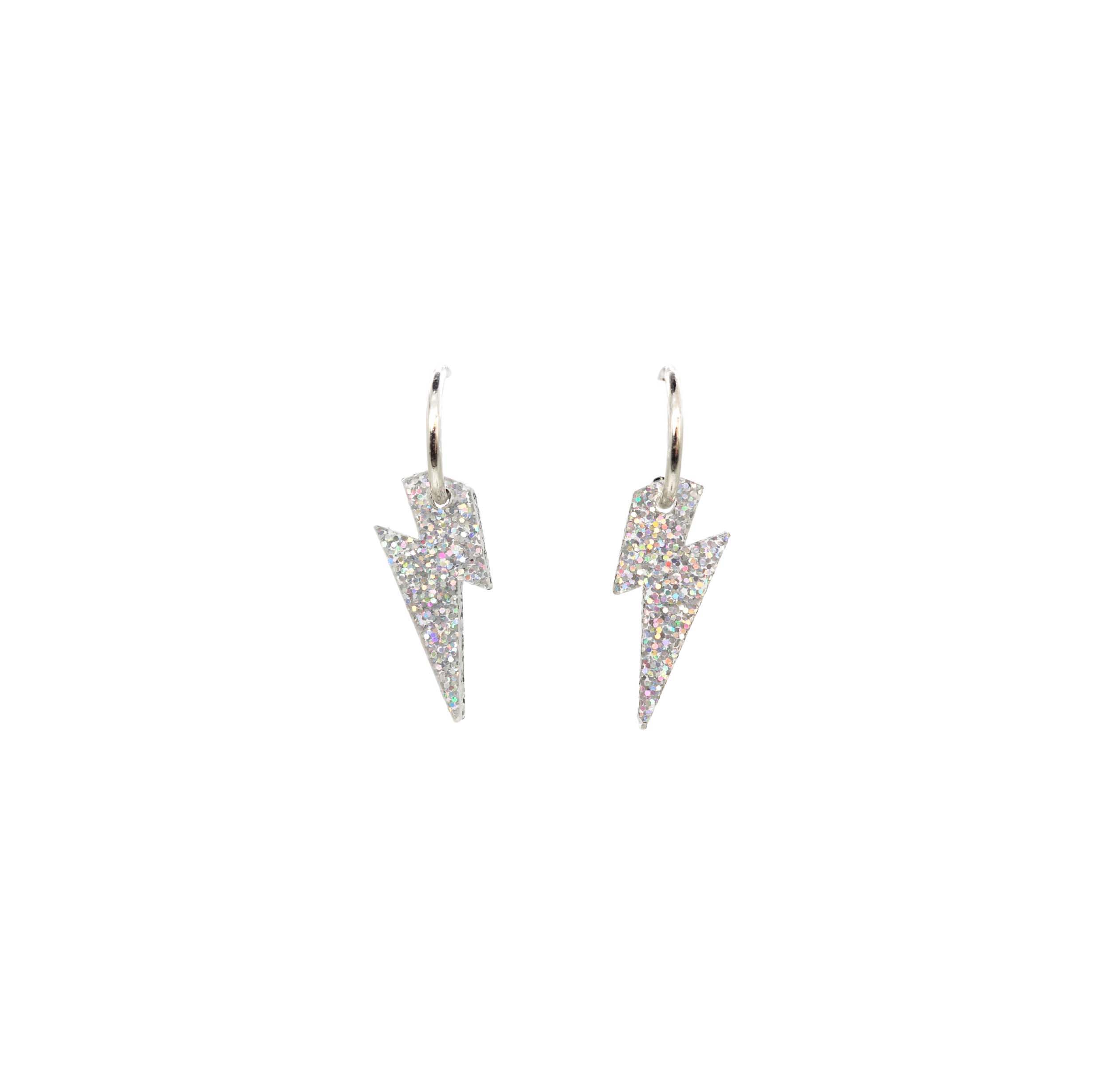 Lightning bolt hoop earrings in silver glitter.