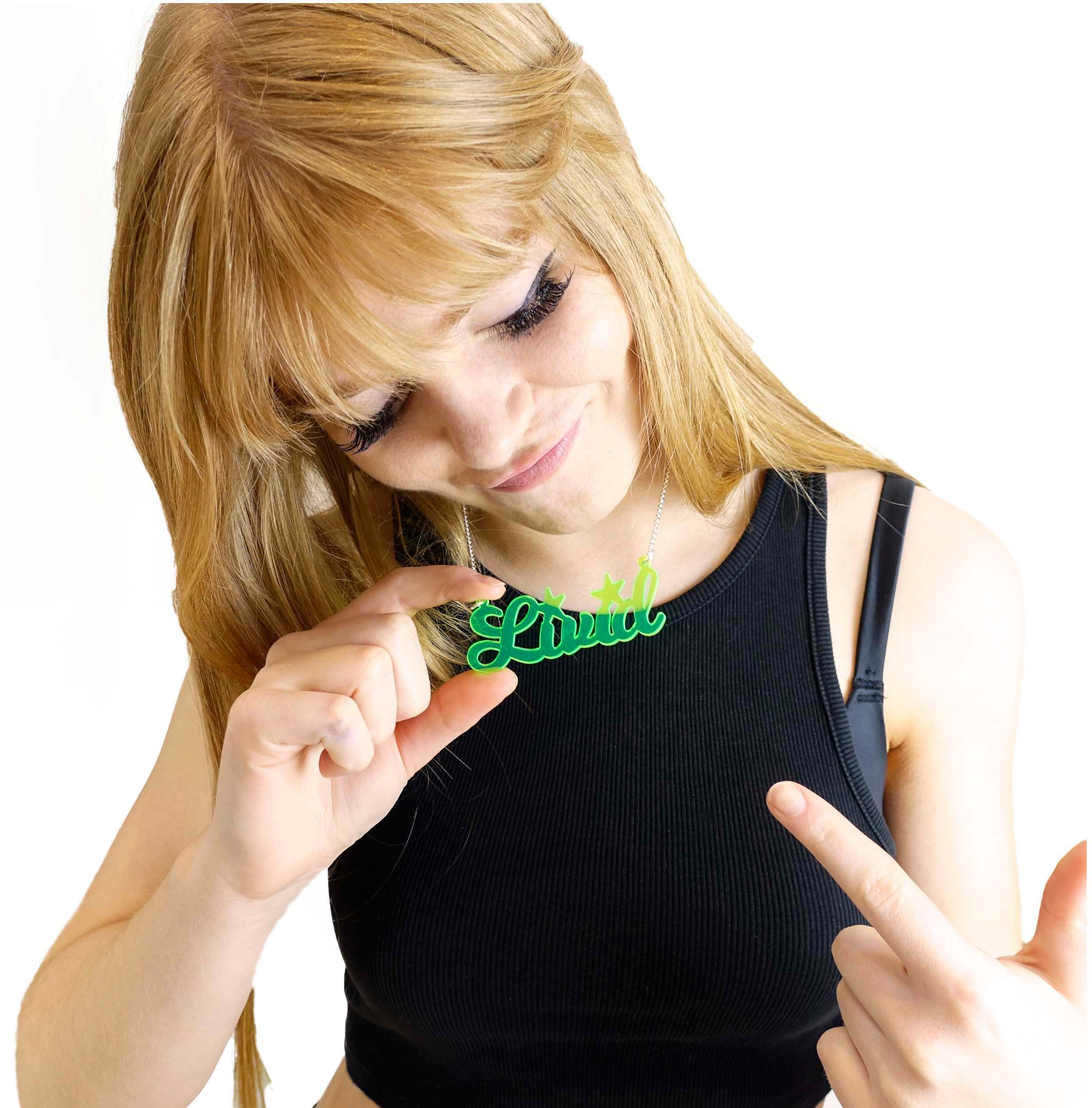 Eliza wears a neon lime Livid necklace.