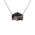 It's all a load of bollocks and bollocks to it all in silver shown hanging on a stainless steel chain.