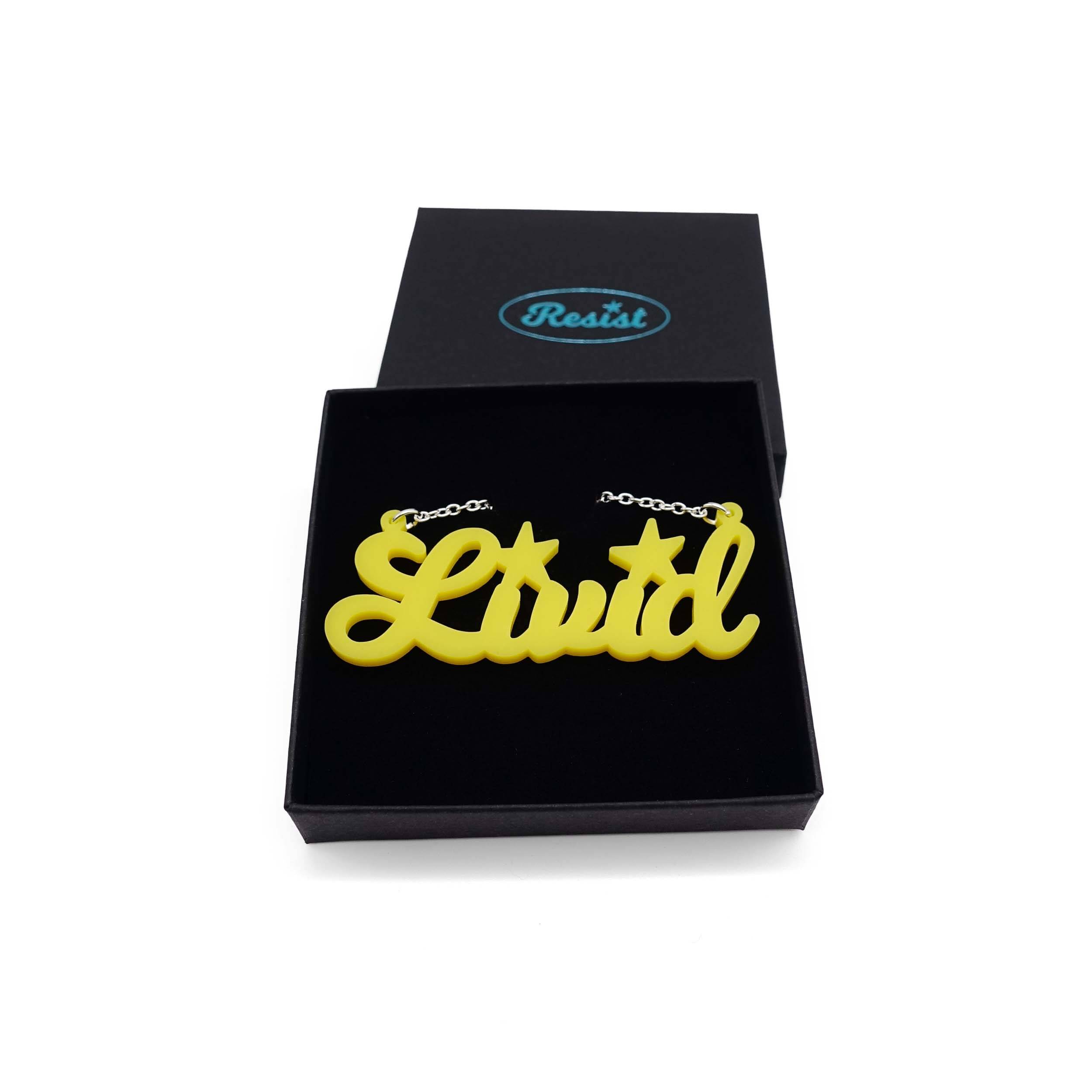 Livid necklace in matte lemon, shown in a Wear and Resist gift box.