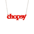 Matte red Chopsy necklace shown hanging against a white backround.
