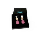 Medium Belle Epoque jewel earrings in pink shown in a Wear and Resist gift box.