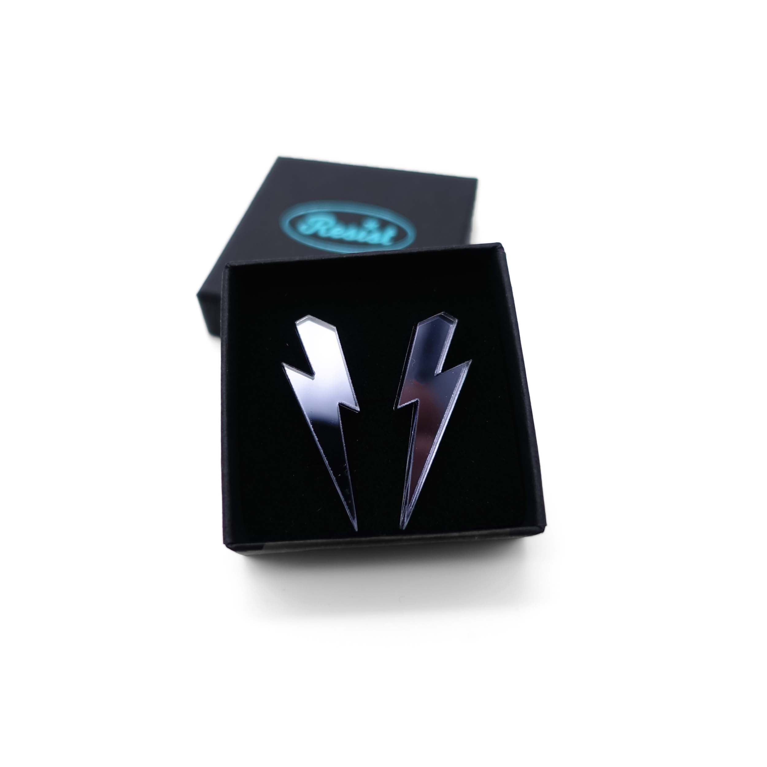 Medium Lightning Bolt earrings in slate mirror, shown in a small Wear and Resist gift box.