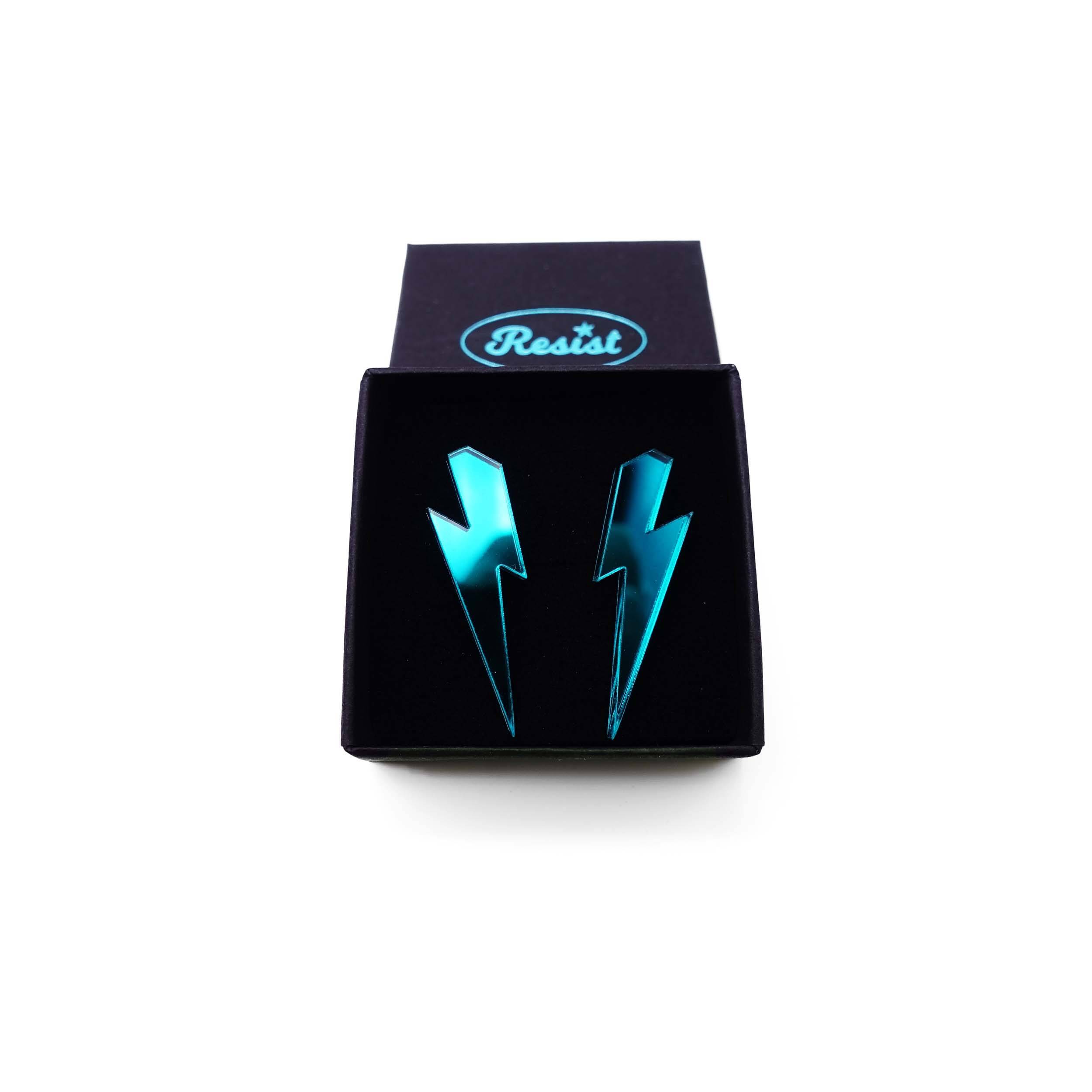 Medium Lightning Bolt earrings in teal mirror, shown in a small Wear and Resist gift box.