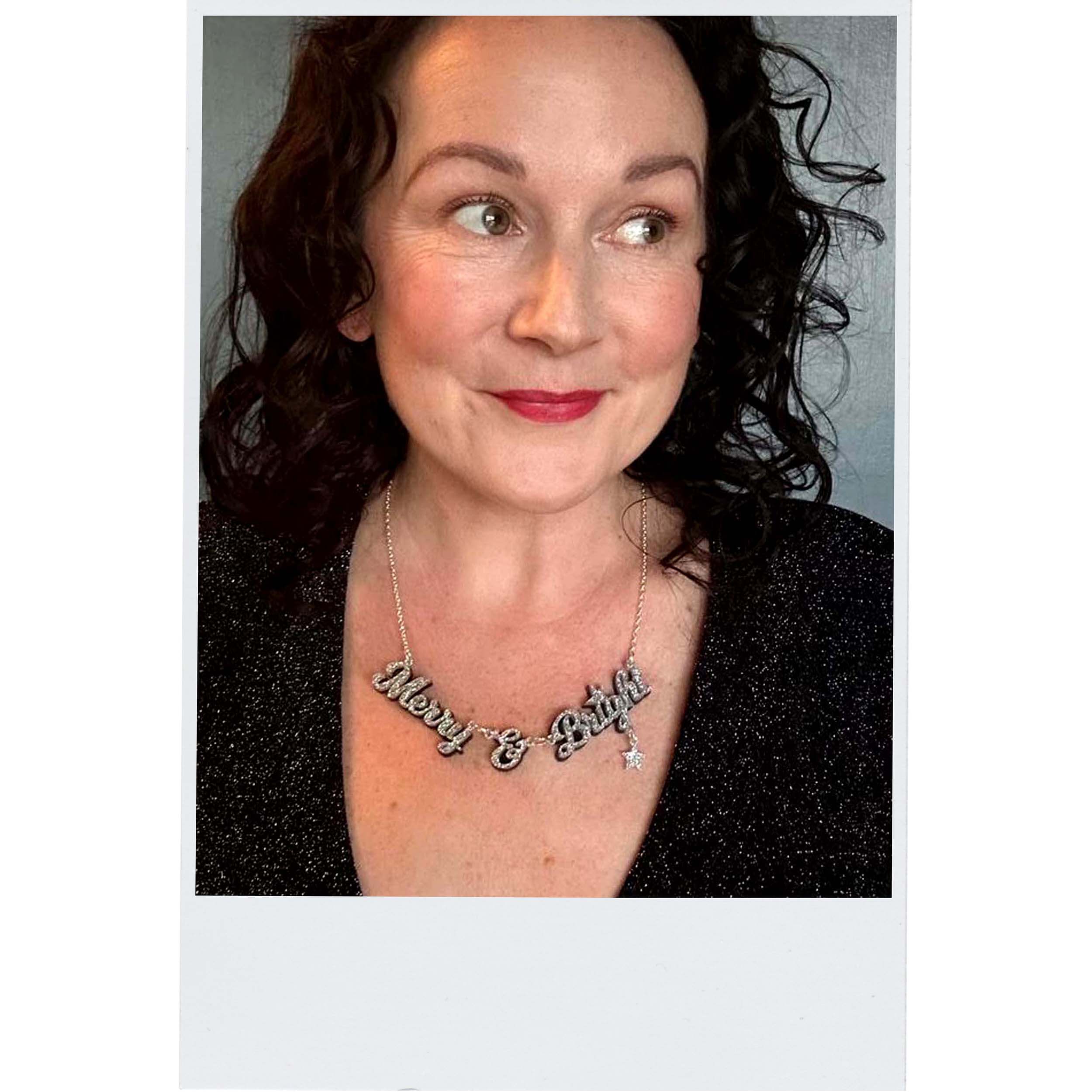 A silver Merry & Bright necklace as worn by the Persisterhood.