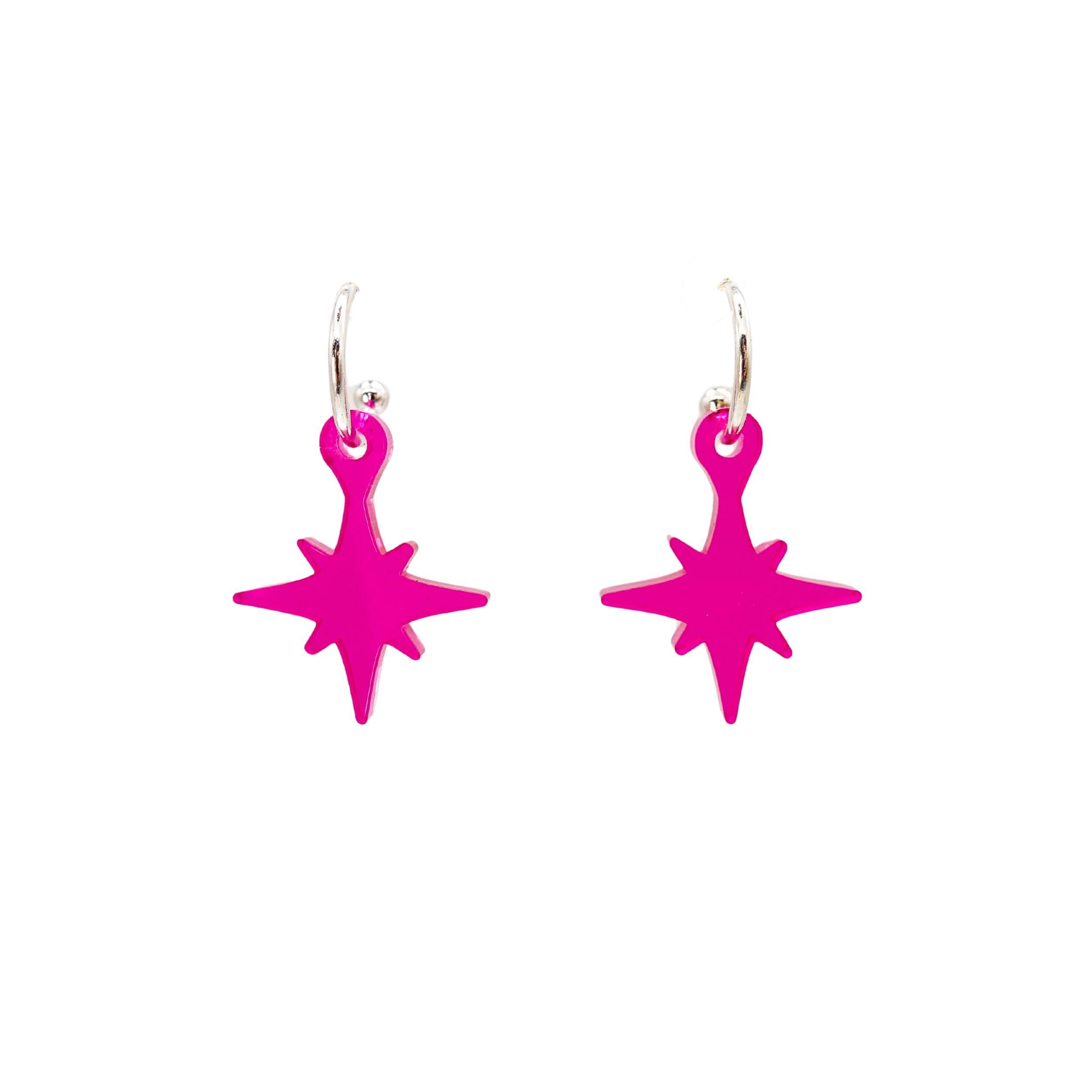 Vintage star earrings in neon pink shown on silver hoops against a white background.