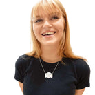 Eliza wears a silver Paid up member of the Persisterhood necklace on a stainless steel chain.