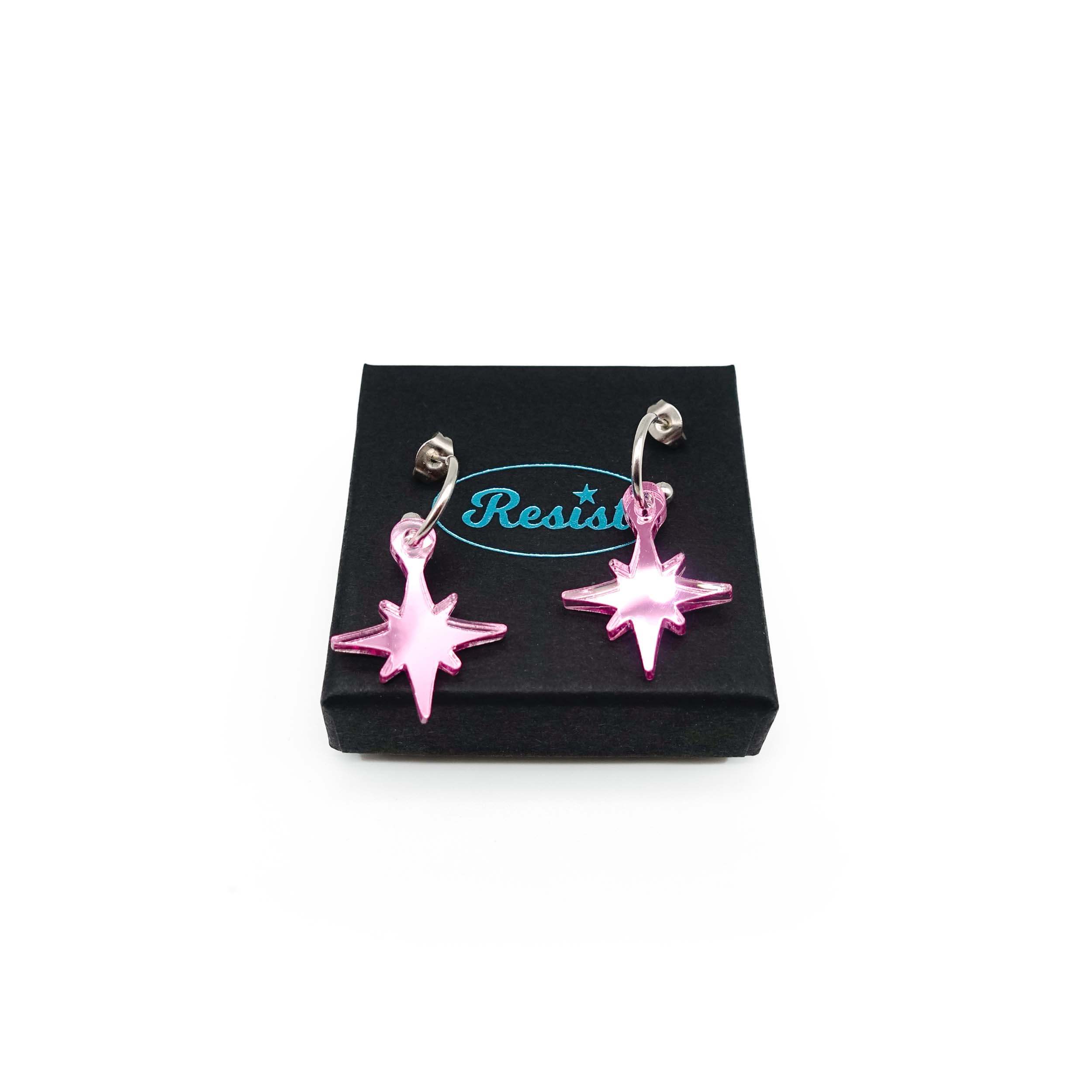 Pink mirror limited edition Festive Vintage Star earrings, shown on a Wear and Resist gift box.