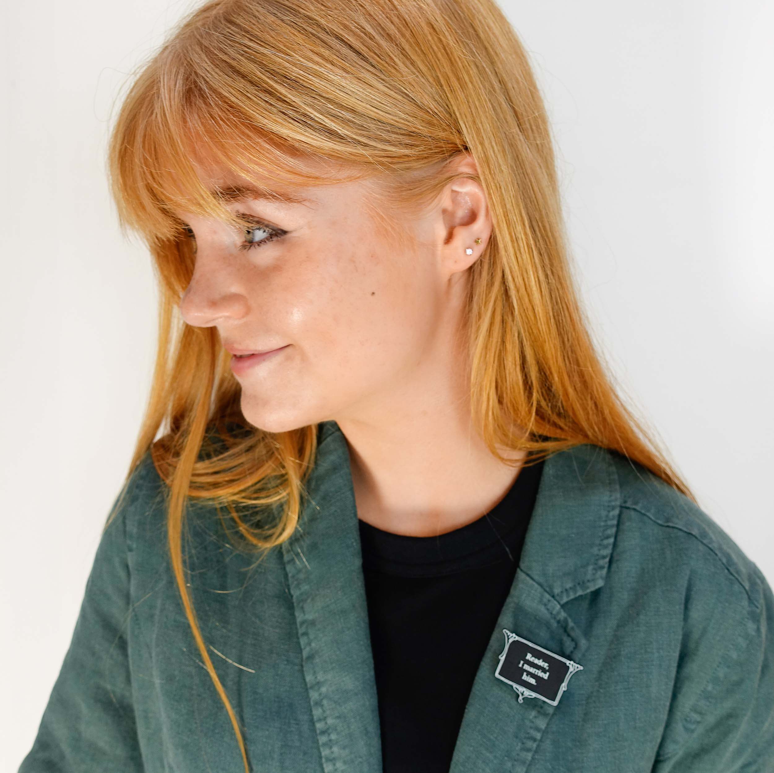 Eliza wears a brooch from The Bronte Collection etched with Reader I married him in glow in the dark pigment.