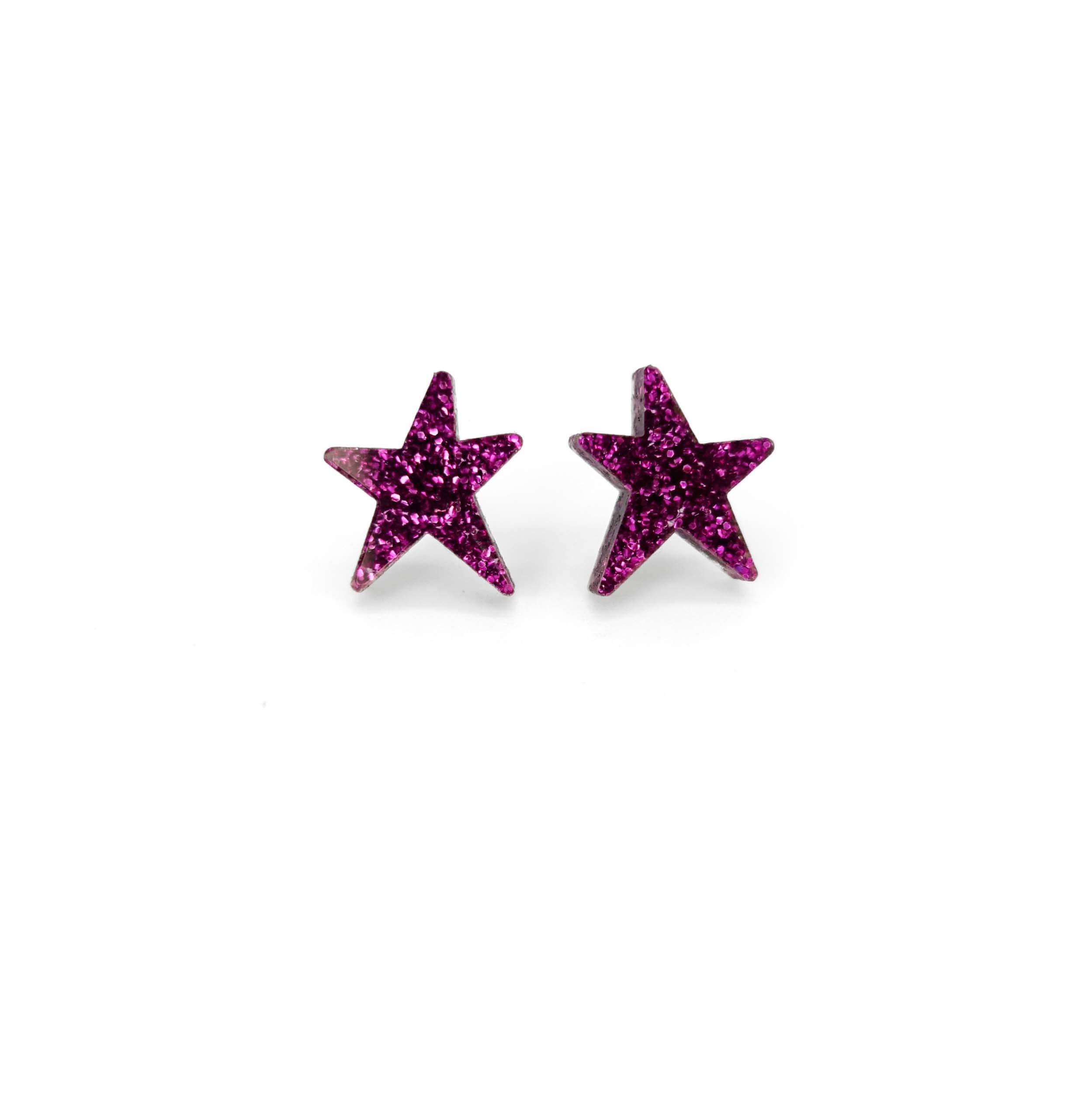 Purple glitter funky Wear and Resist star earrings shown on a white background.